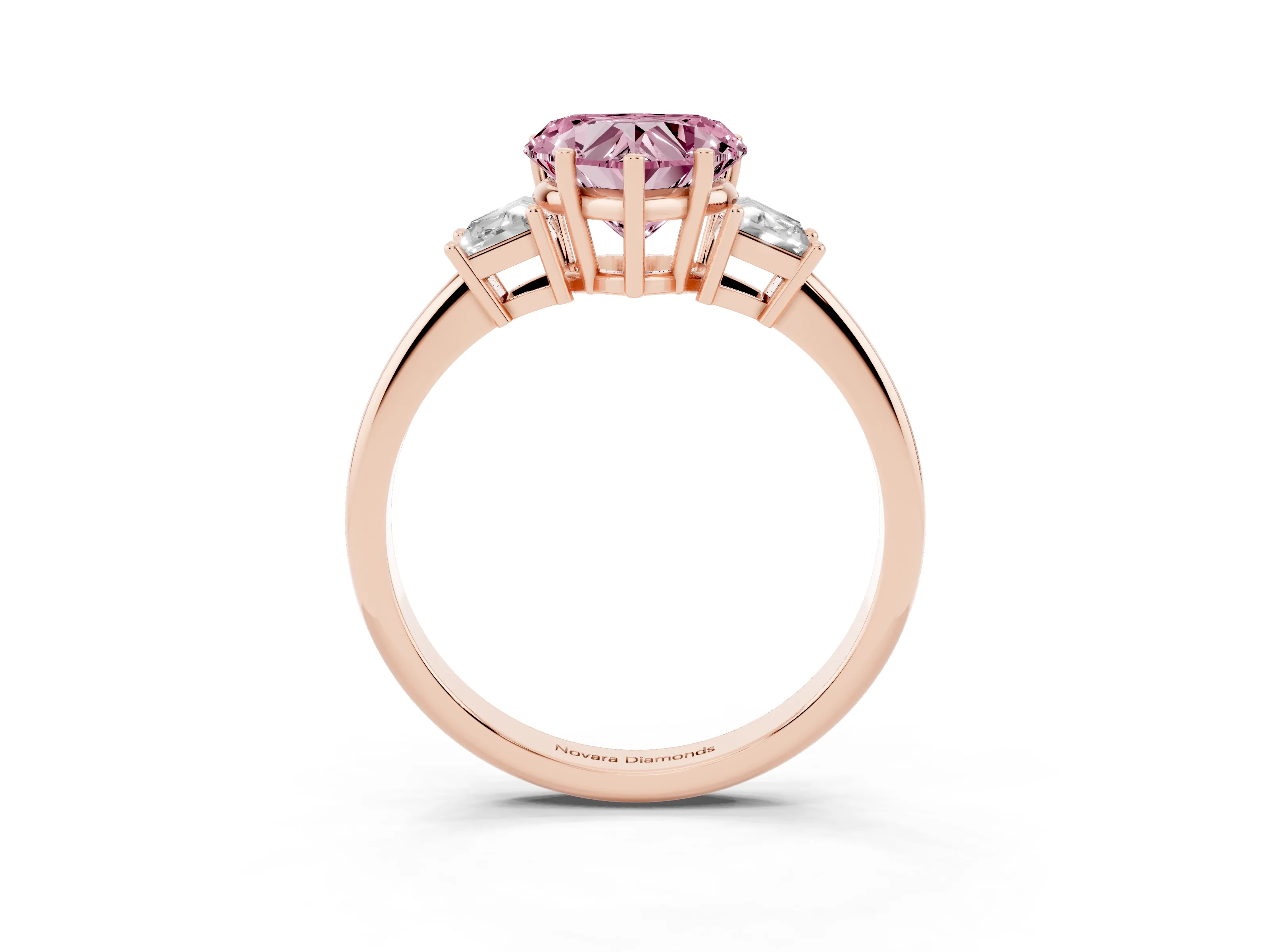 Fancy Pink Heart Cut Diamond Three-Stone Ring Set in Rose gold with Trapezoid Side Stones and Prong Setting