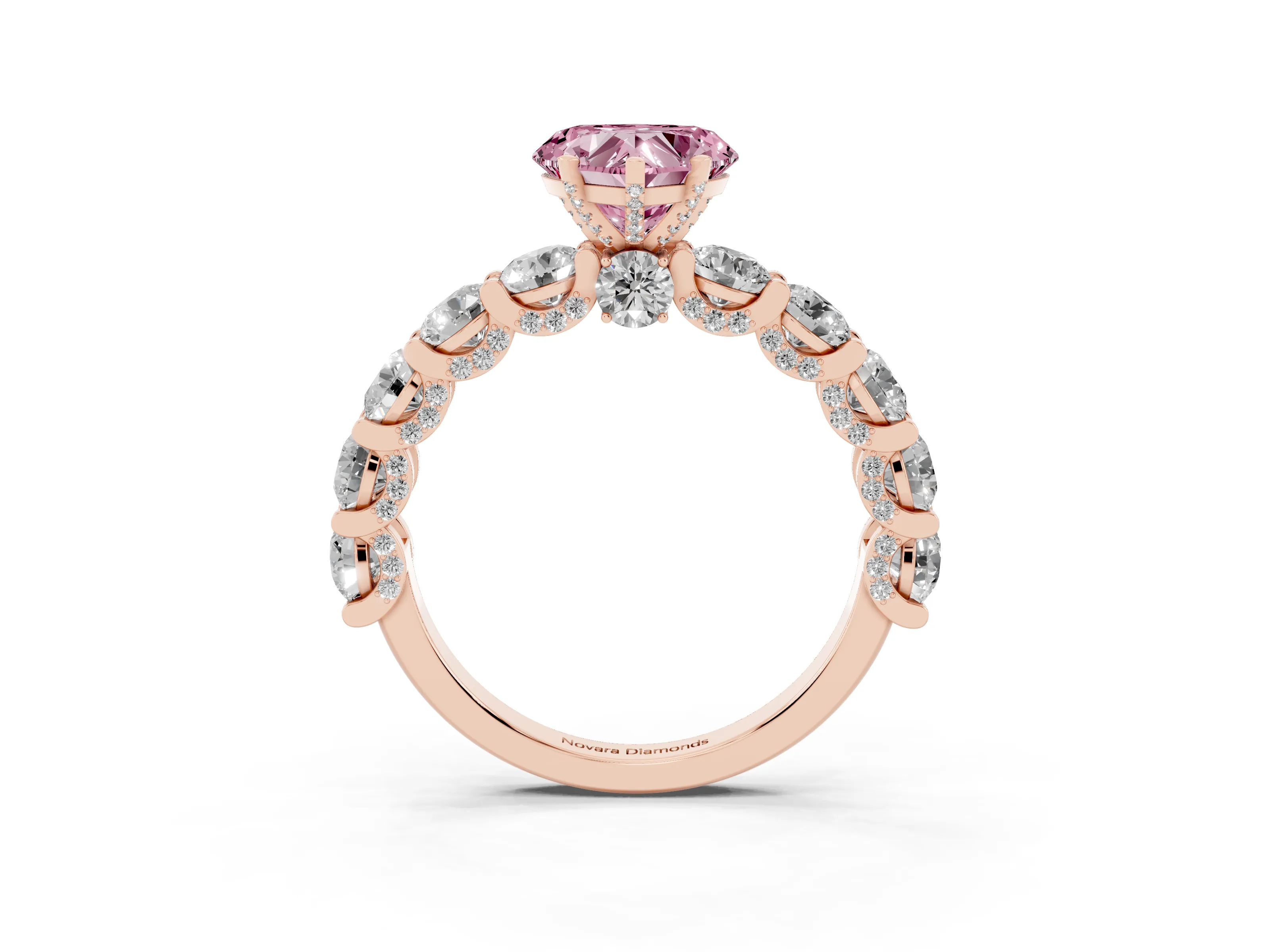 Fancy Pink Heart Cut Diamond Side Stone Ring Set in Rose gold with Alternating Round and Oval Side Stones