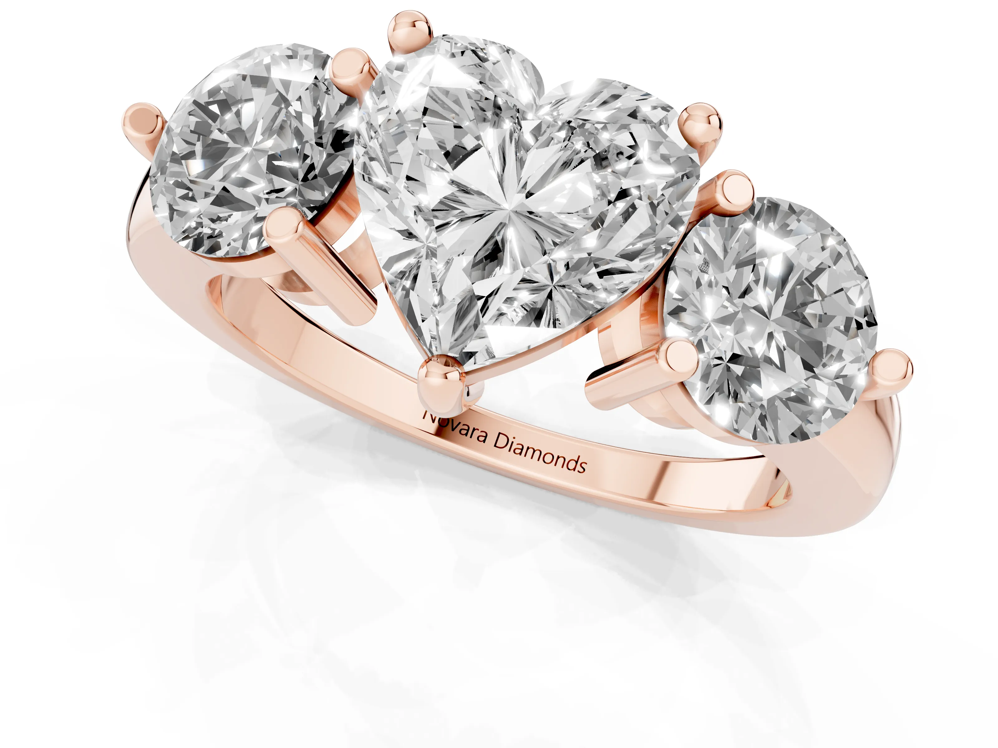 Heart Cut Diamond Three-Stone Ring Set in Rose gold with Prong Setting and Classic Band