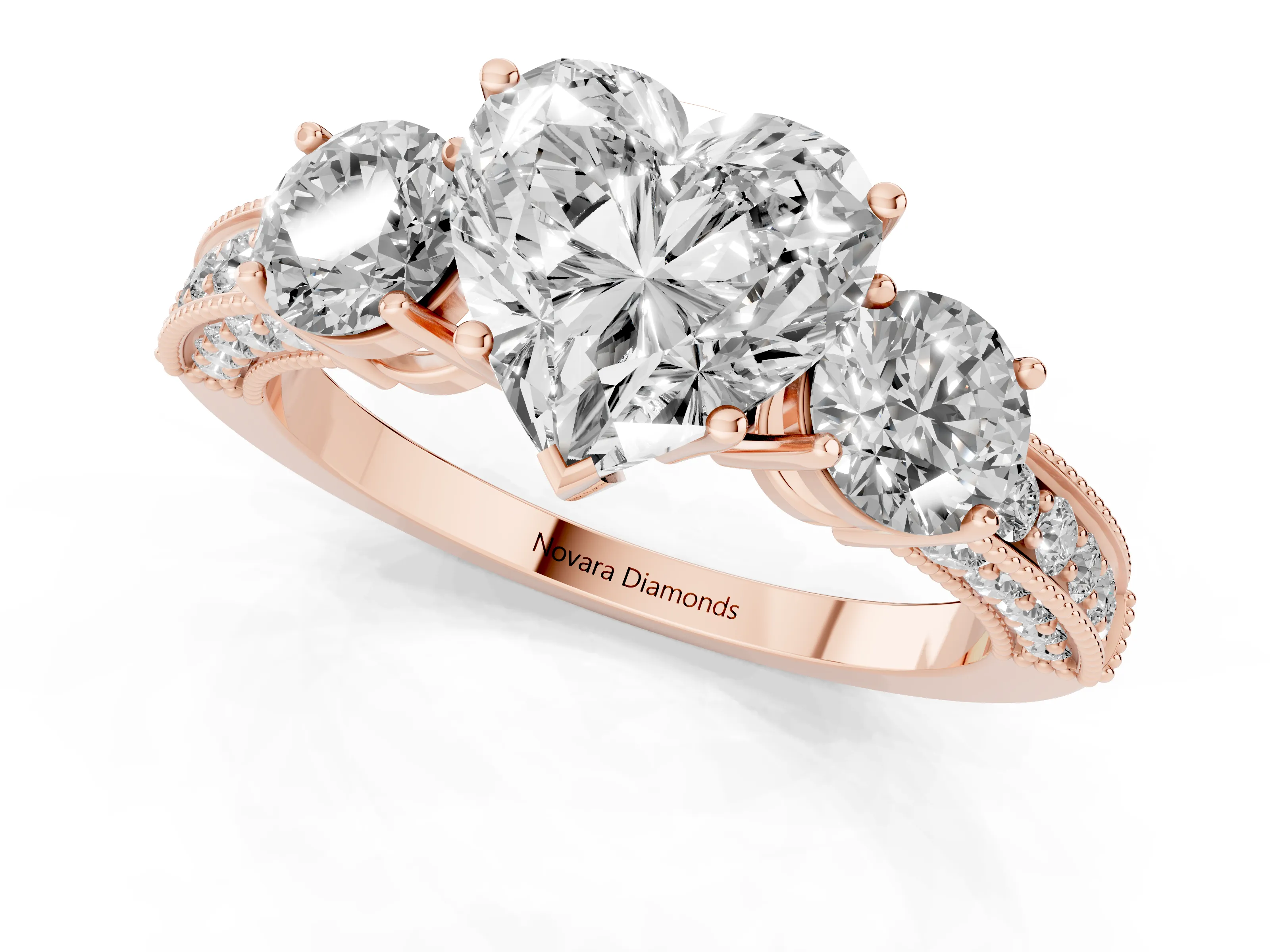 Heart Cut Diamond Three-Stone Ring Set in Rose gold with Round Side Stones and Pavé Band