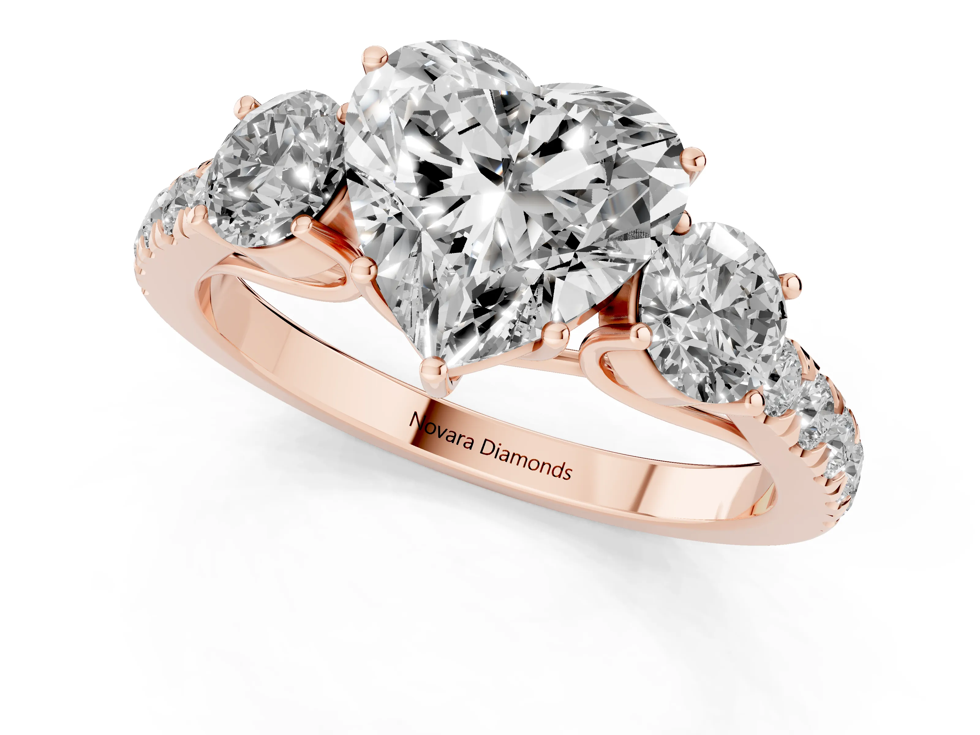 Heart Cut Diamond Three-Stone Ring Set in Rose gold with Round Side Stones and Delicate Pavé Band