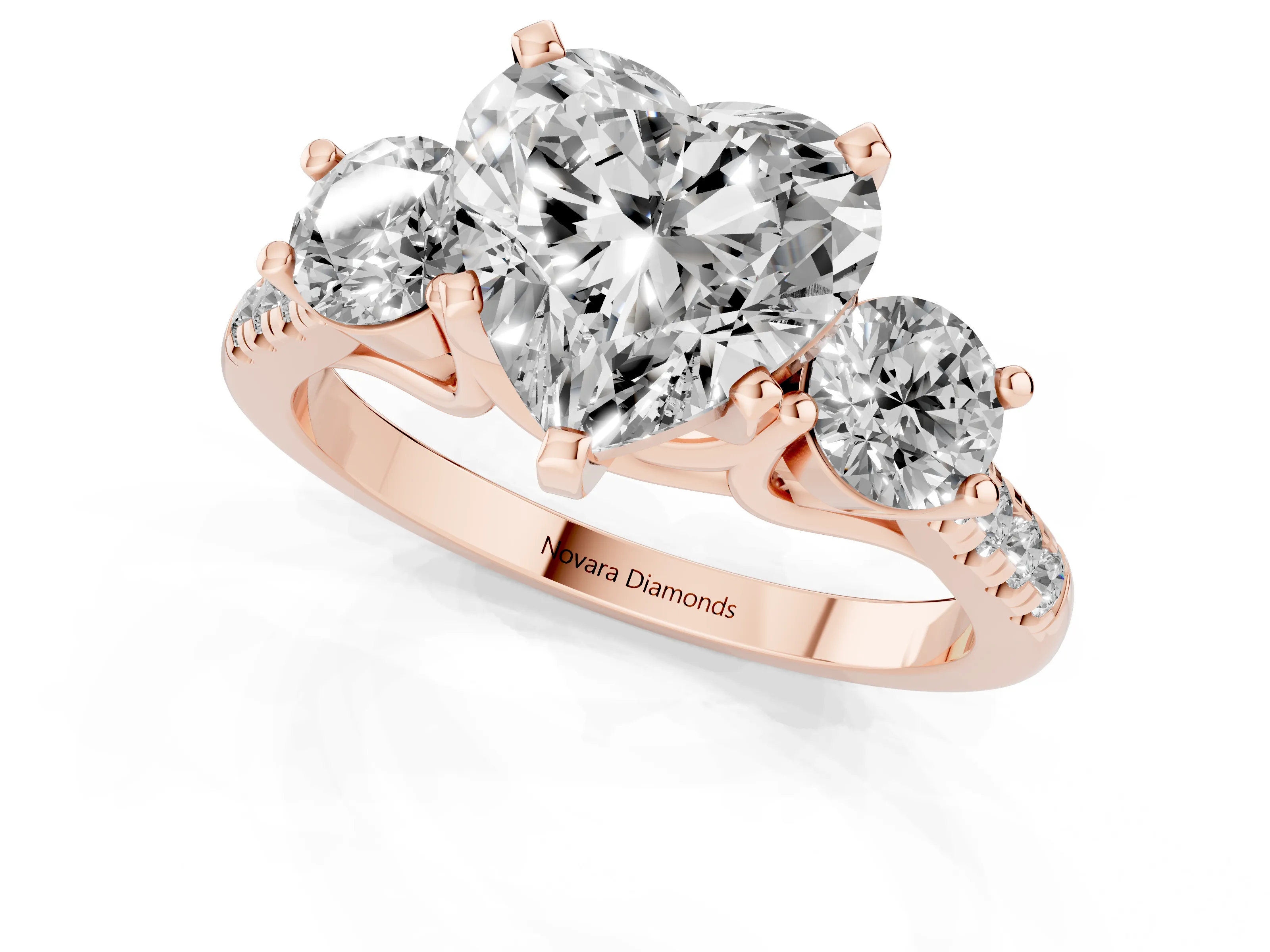 Three-Stone Heart Cut Diamond Pavé Band Ring Set in Rose gold with Prong-Set Trio