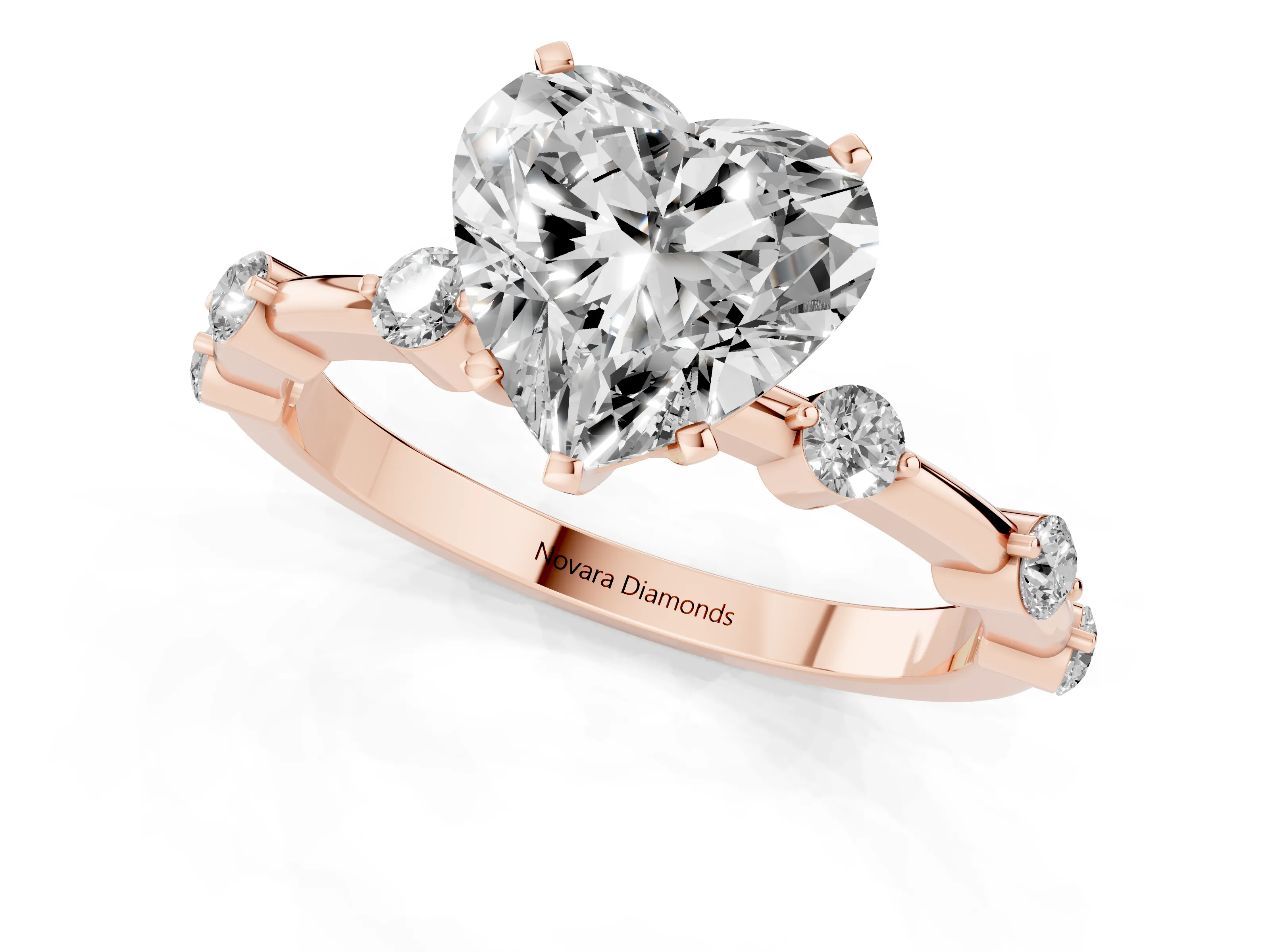Heart Cut Diamond Solitaire Ring Set in Rose gold with Bezel Set Side Stones and Prong Setting