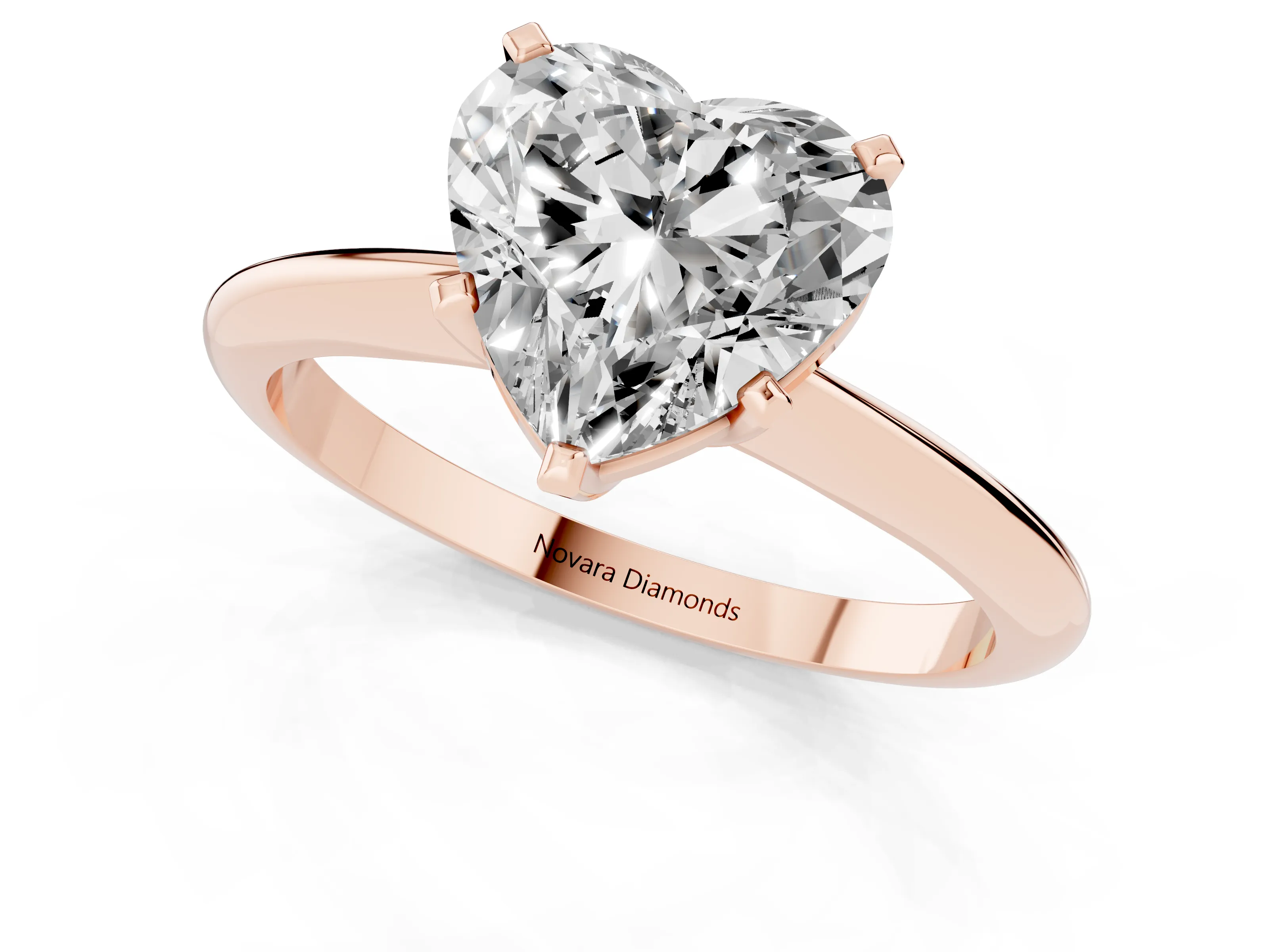 Heart Cut Diamond Solitaire Ring Set in Rose gold with Prong Setting on a Plain Round Band