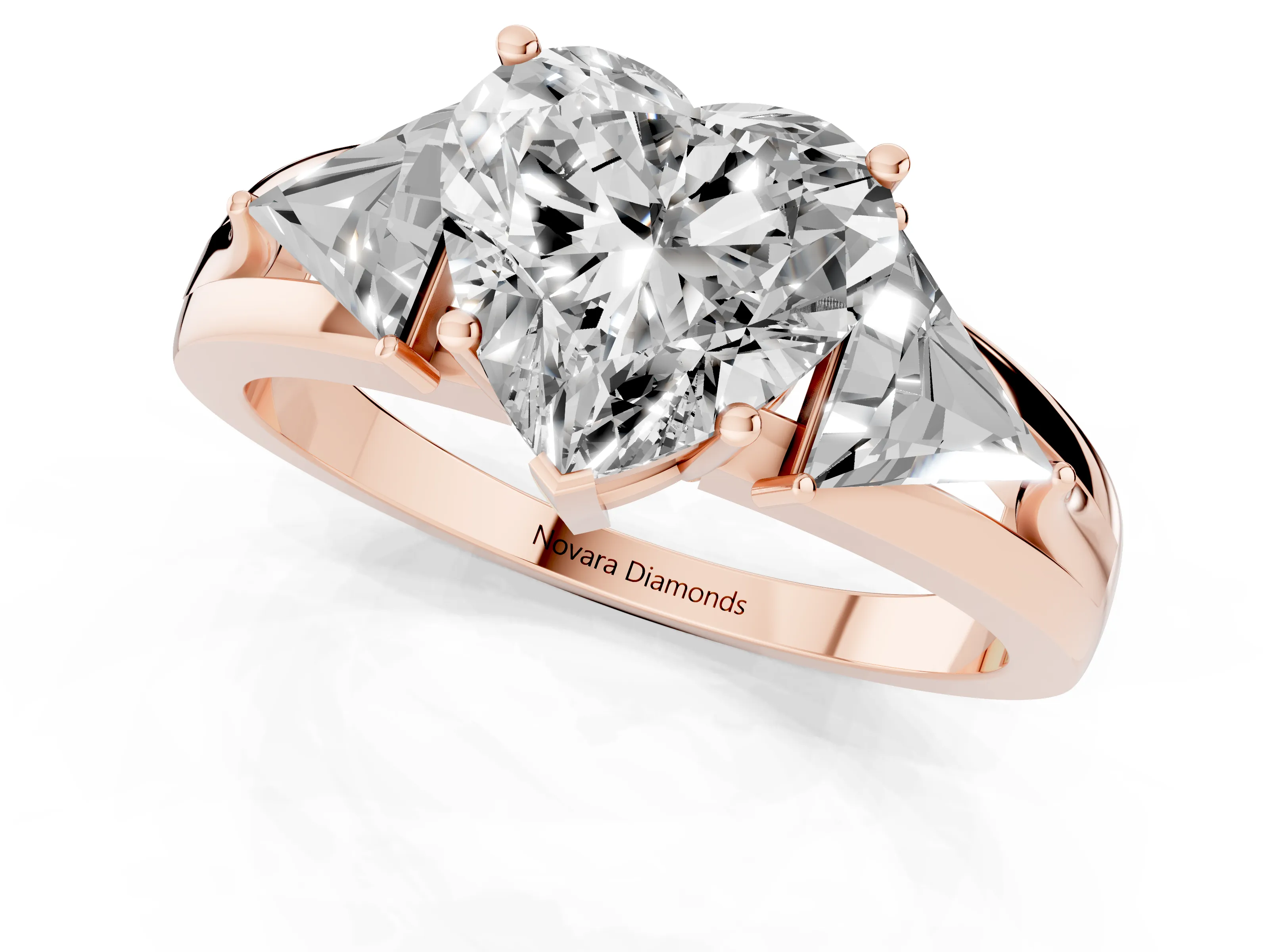 Heart Cut Diamond Three-Stone Ring Set in Rose gold with Trillion Side Stones and Split Shank