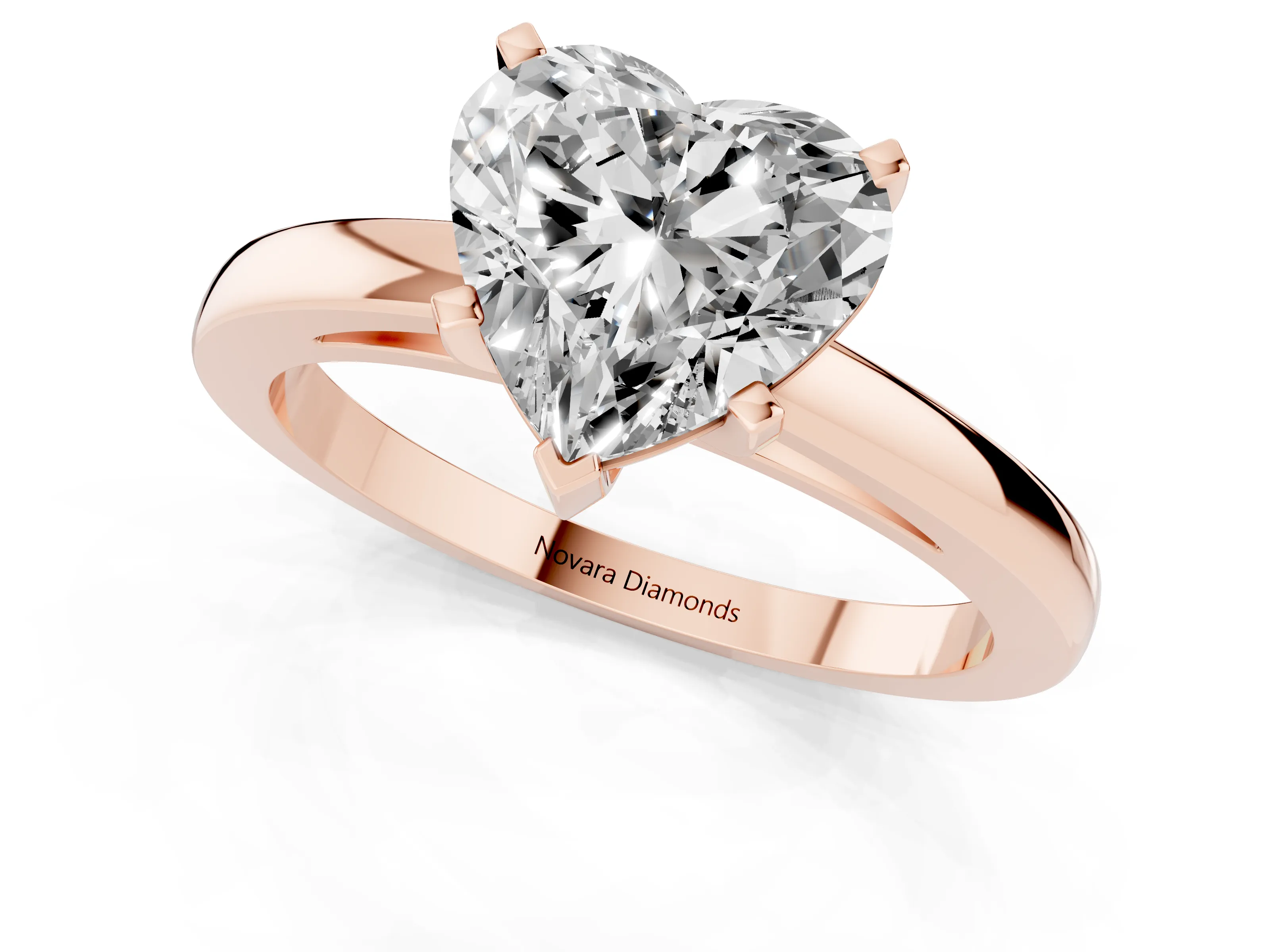 Heart Cut Diamond Solitaire Engagement Ring Set in Rose gold with Prong Setting on a Classic Band