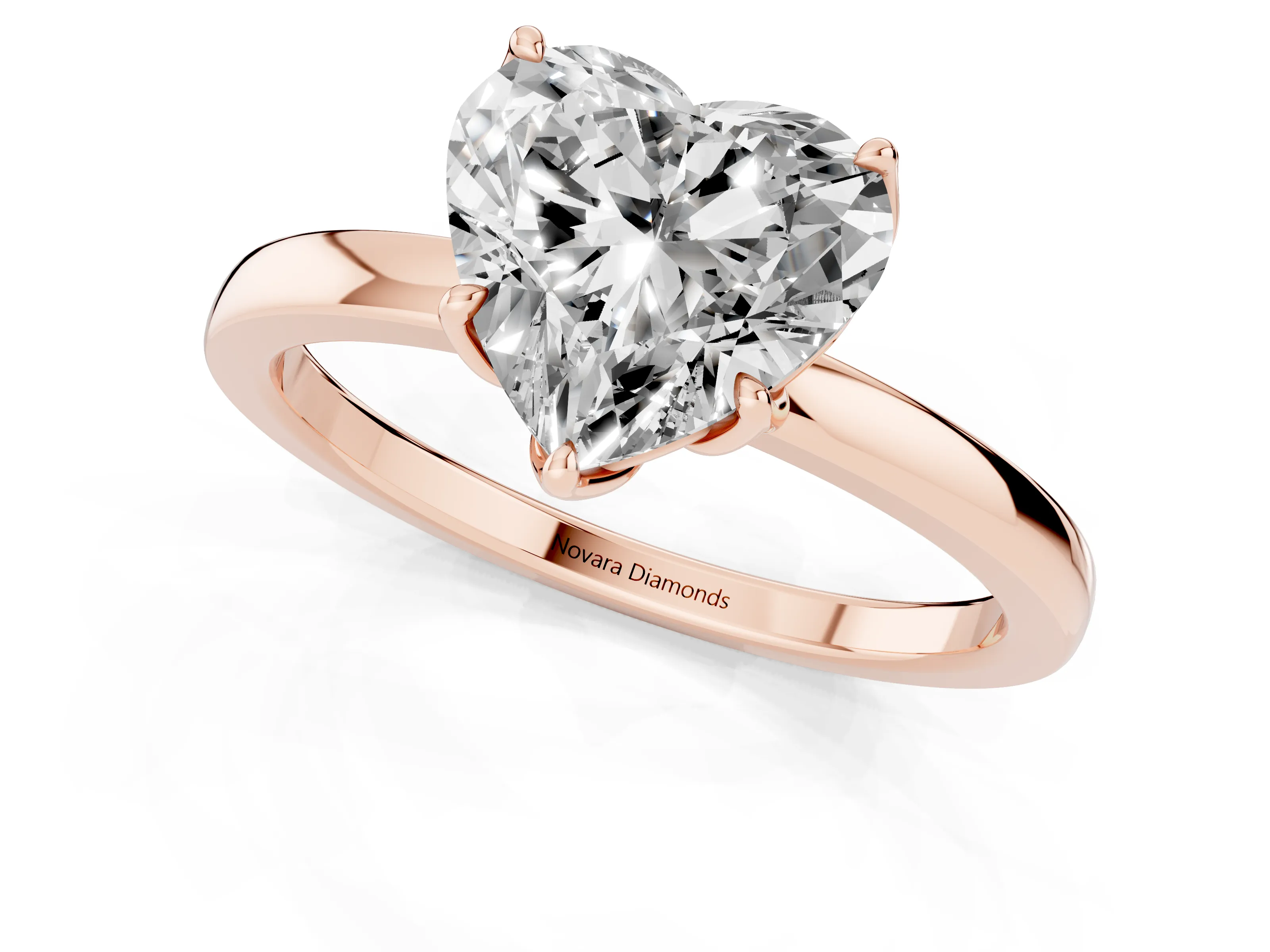 Heart Cut Diamond Solitaire Ring Set in Rose gold with Prong Setting and Thin Polished Band