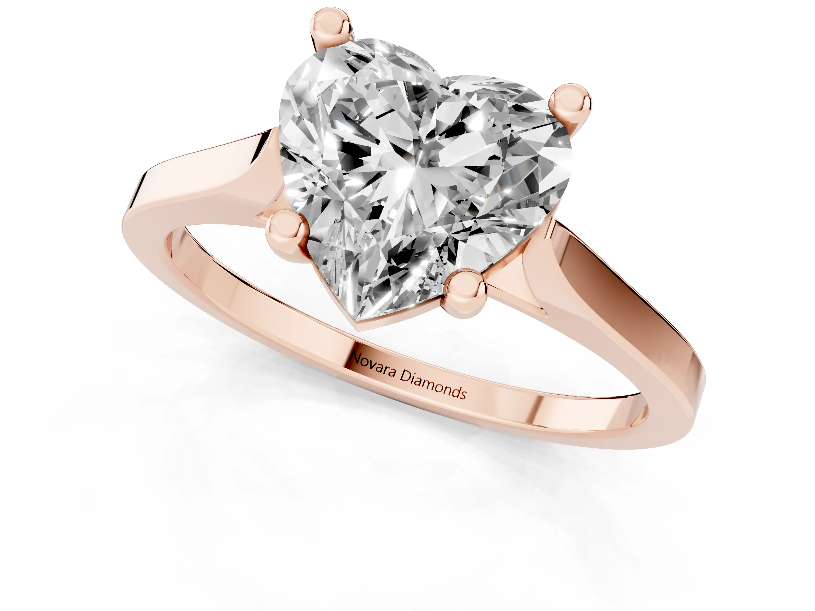 Heart Cut Diamond Solitaire Ring Set in Rose gold with Prong Setting and Tapered Band