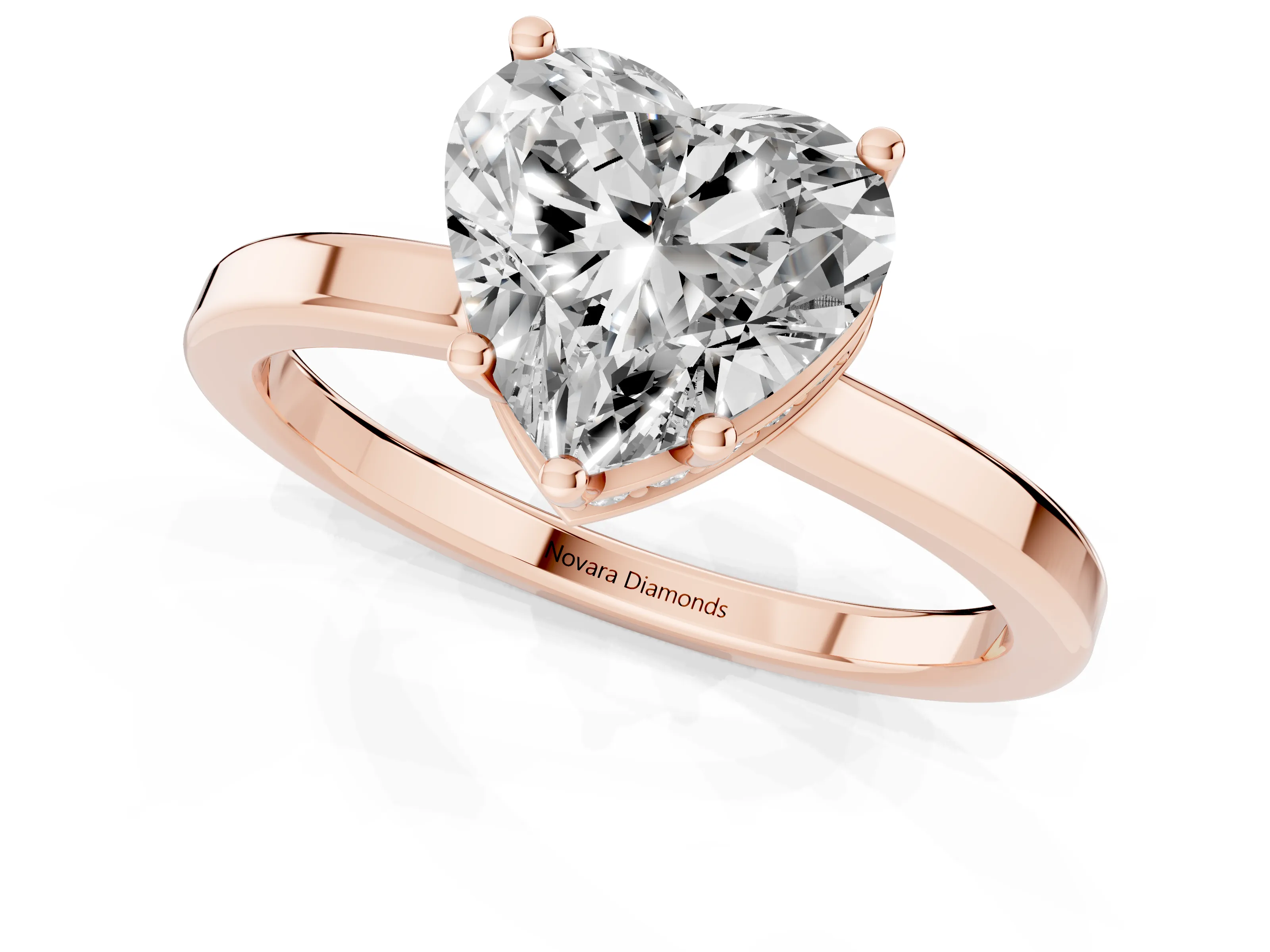Heart Cut Diamond Solitaire Engagement Ring Set in Rose gold with Prong Setting on a Plain Band