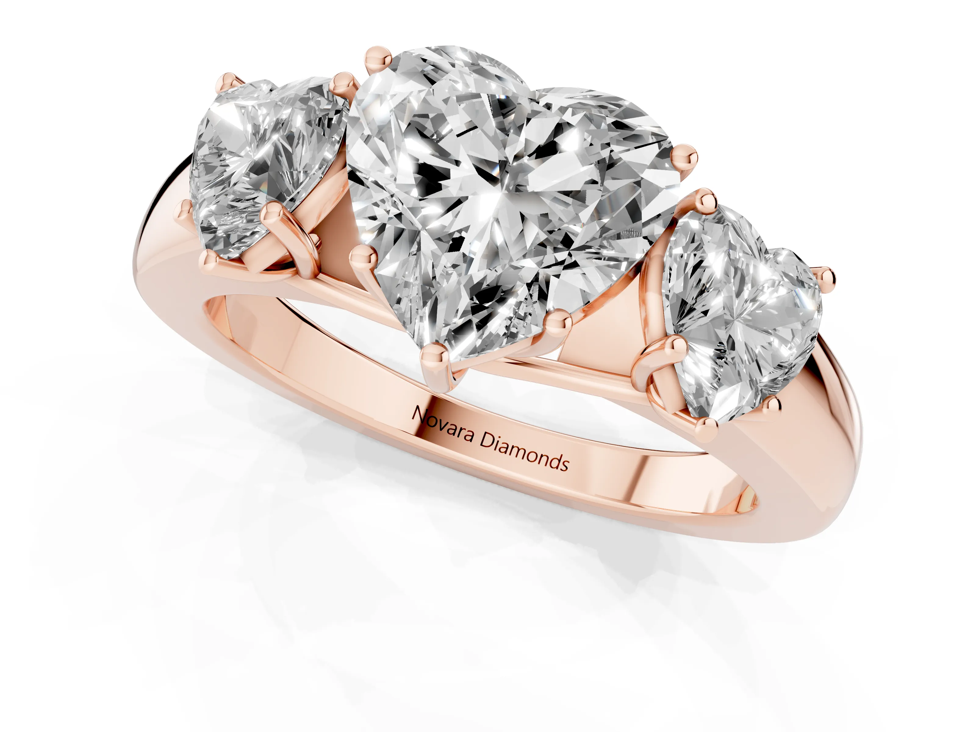 Three-Stone Heart Cut Diamond Ring Set in Rose gold with Matching Prong Settings and Plain Band