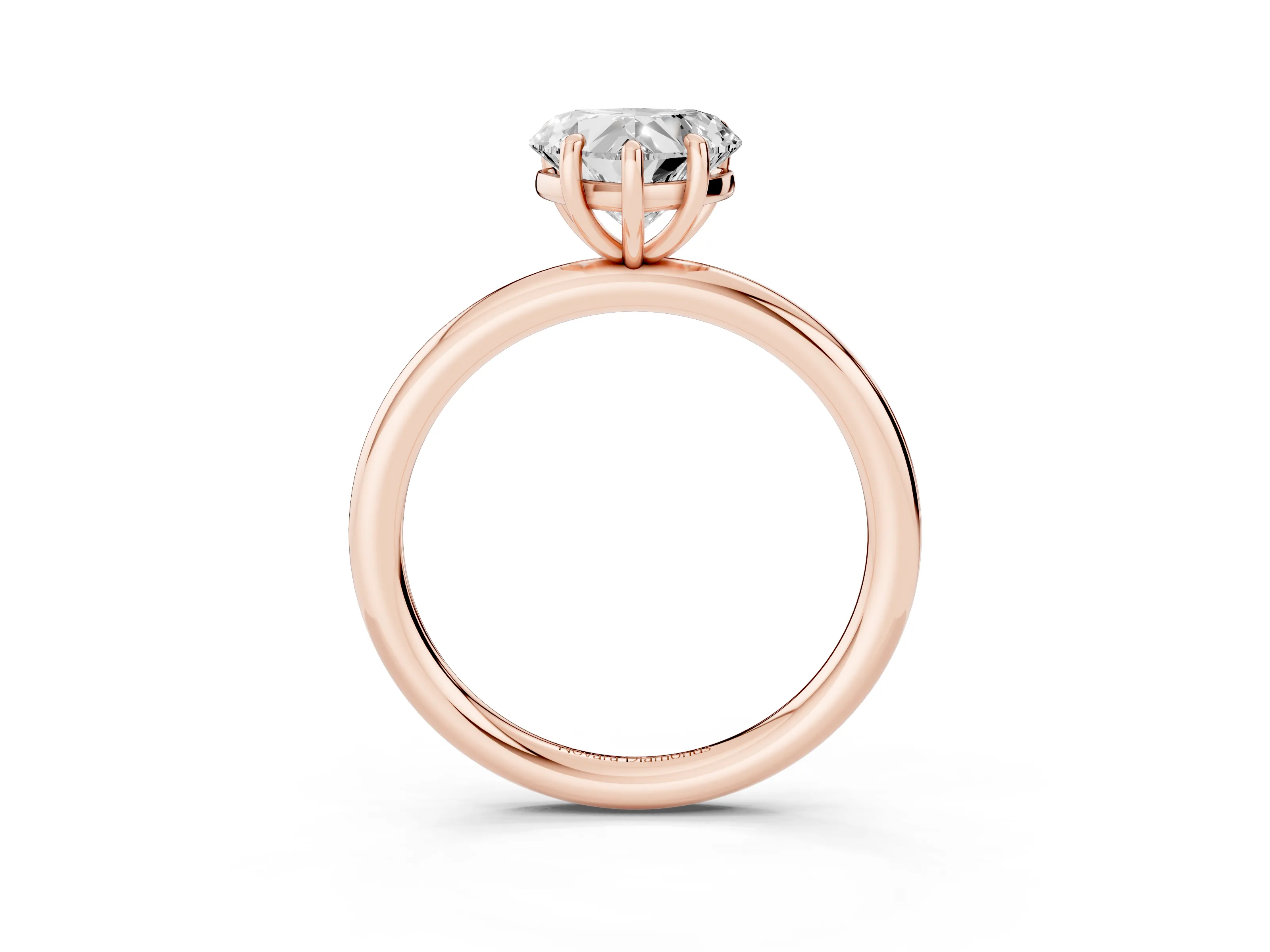 Heart Cut Diamond Solitaire Ring Set in Rose gold with Prong Setting on a Polished Plain Band