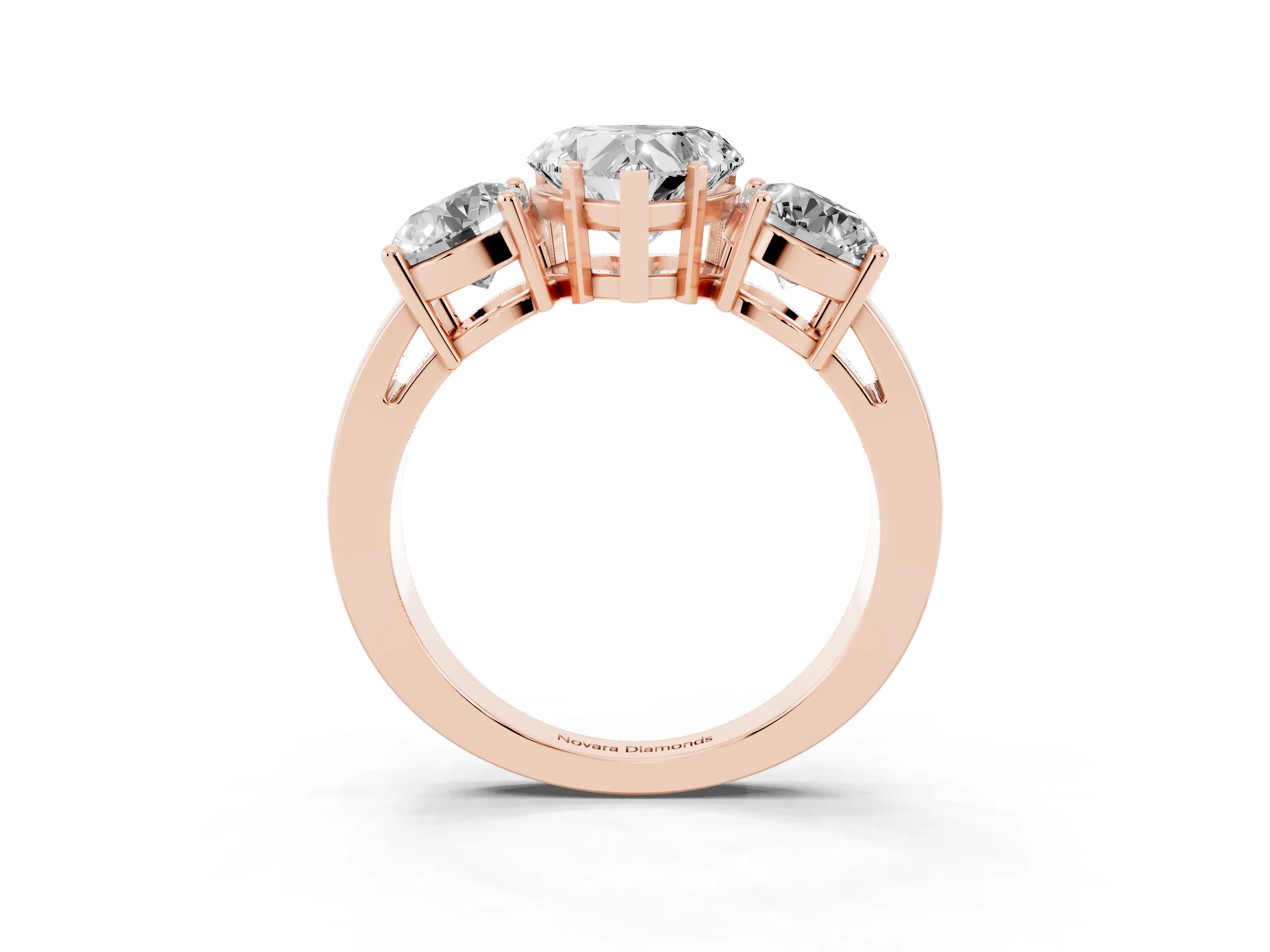 Heart Cut Diamond Three-Stone Ring Set in Rose gold with Round Side Stones and Classic Band