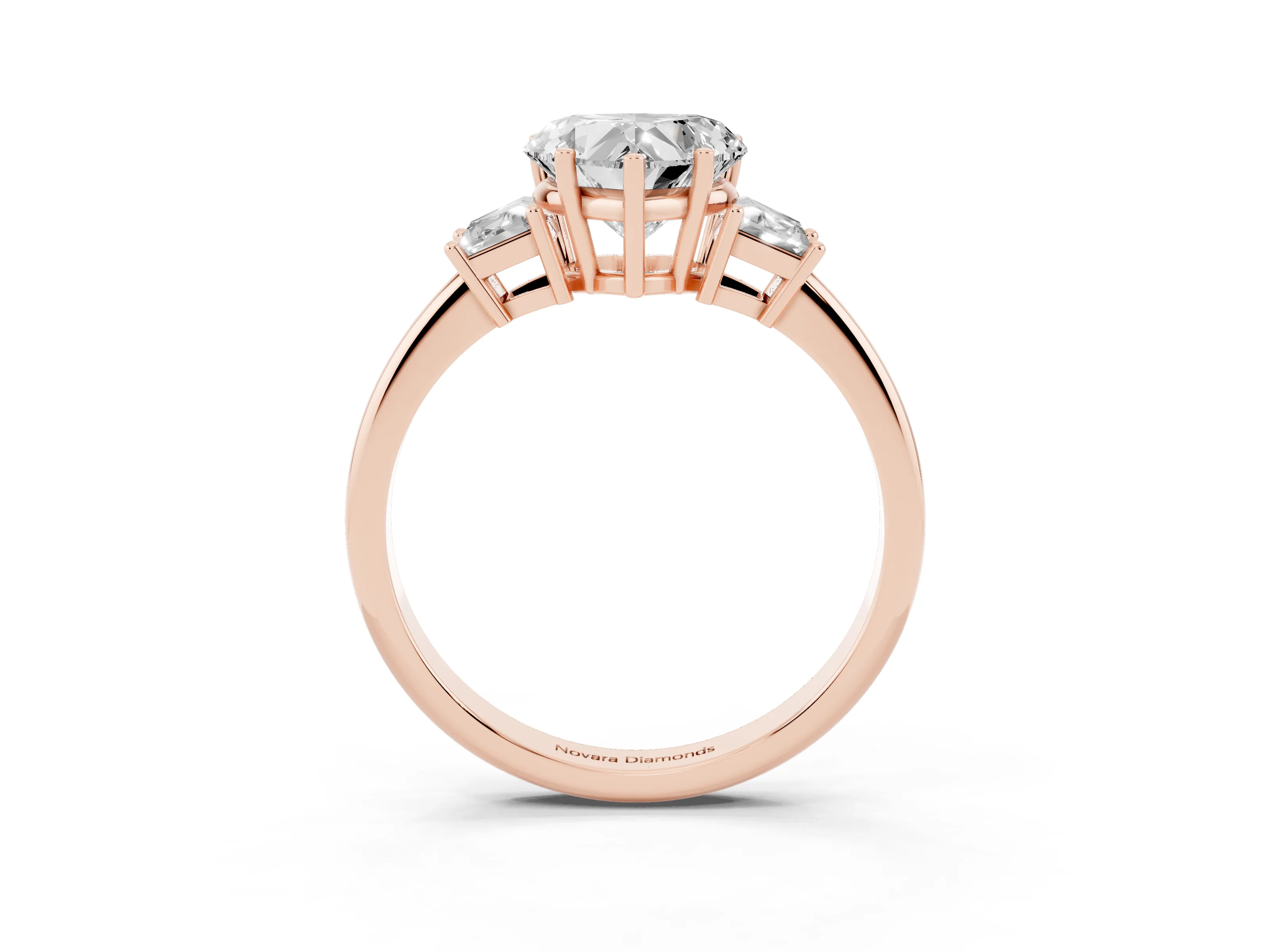 Heart Cut Diamond Three-Stone Ring Set in Rose gold with Trapezoid Side Stones and Prong Setting