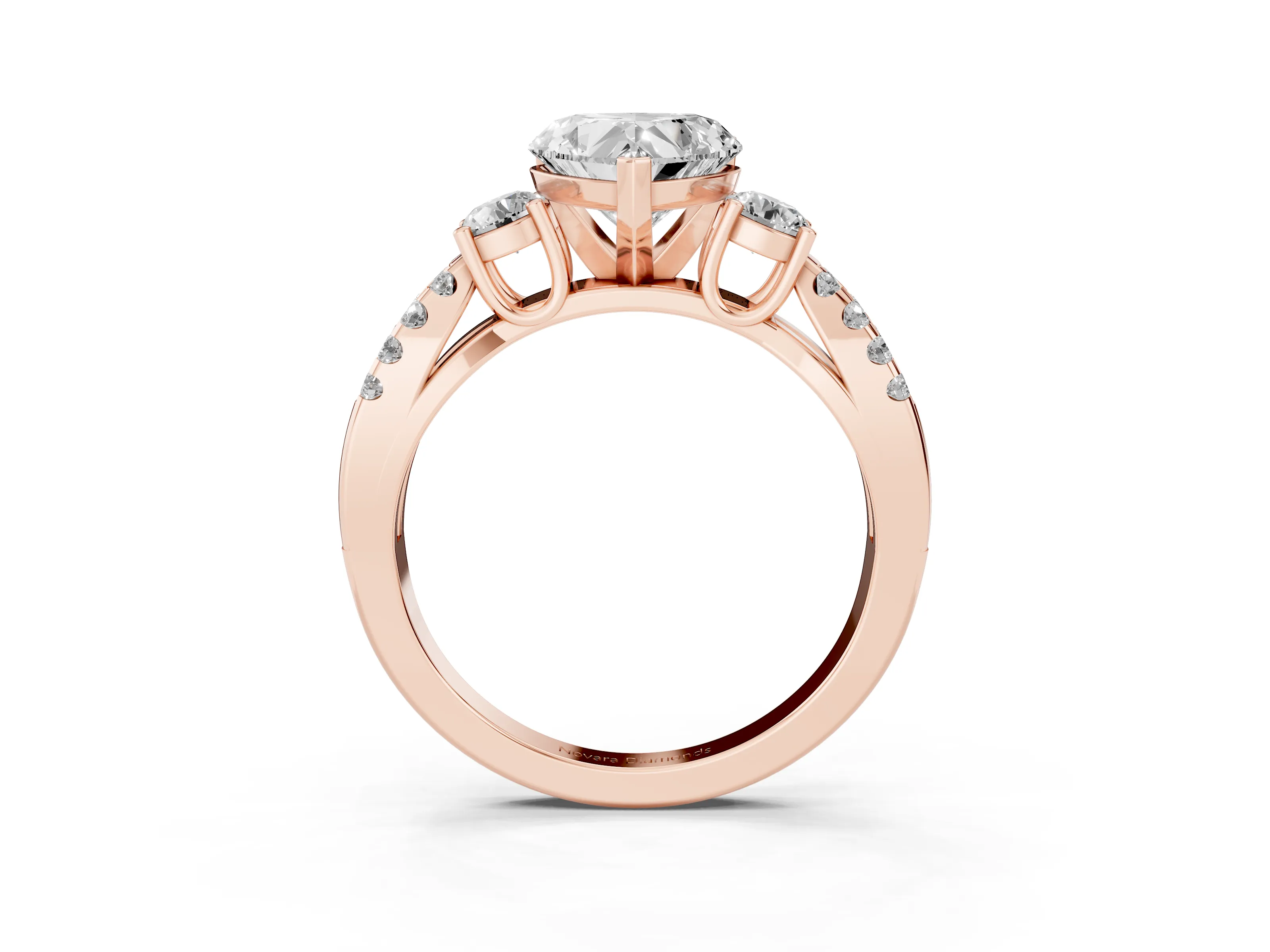 Heart Cut Diamond Three-Stone Ring Set in Rose gold with Pavé Split Shank and Prong Setting