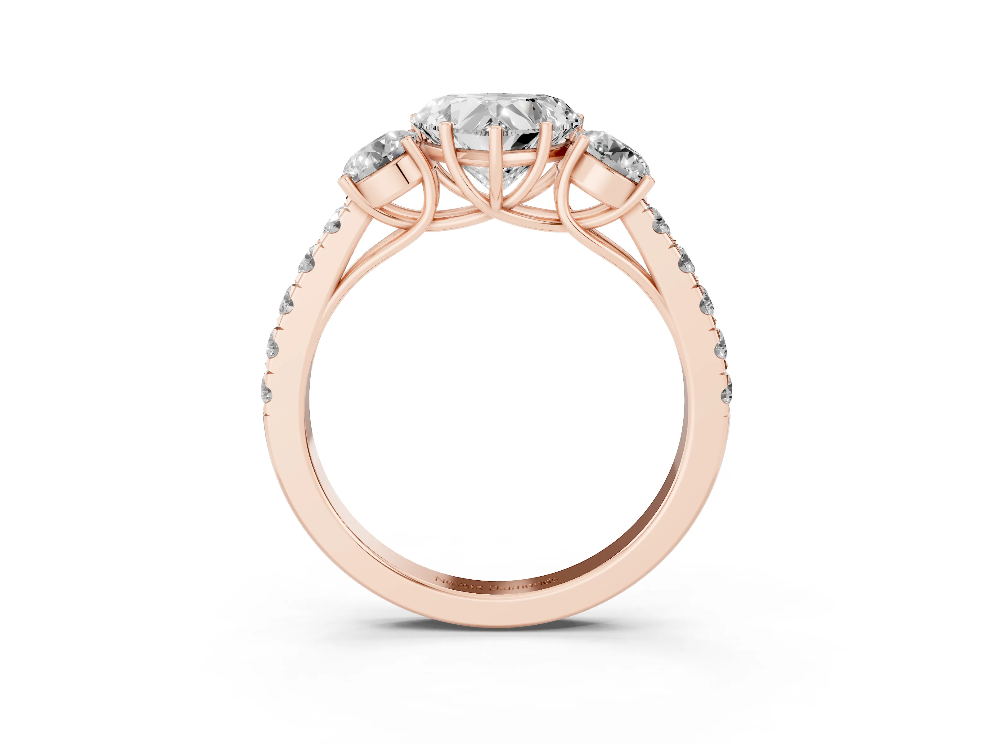 Heart Cut Diamond Three-Stone Ring Set in Rose gold with Round Side Stones and Delicate Pavé Band