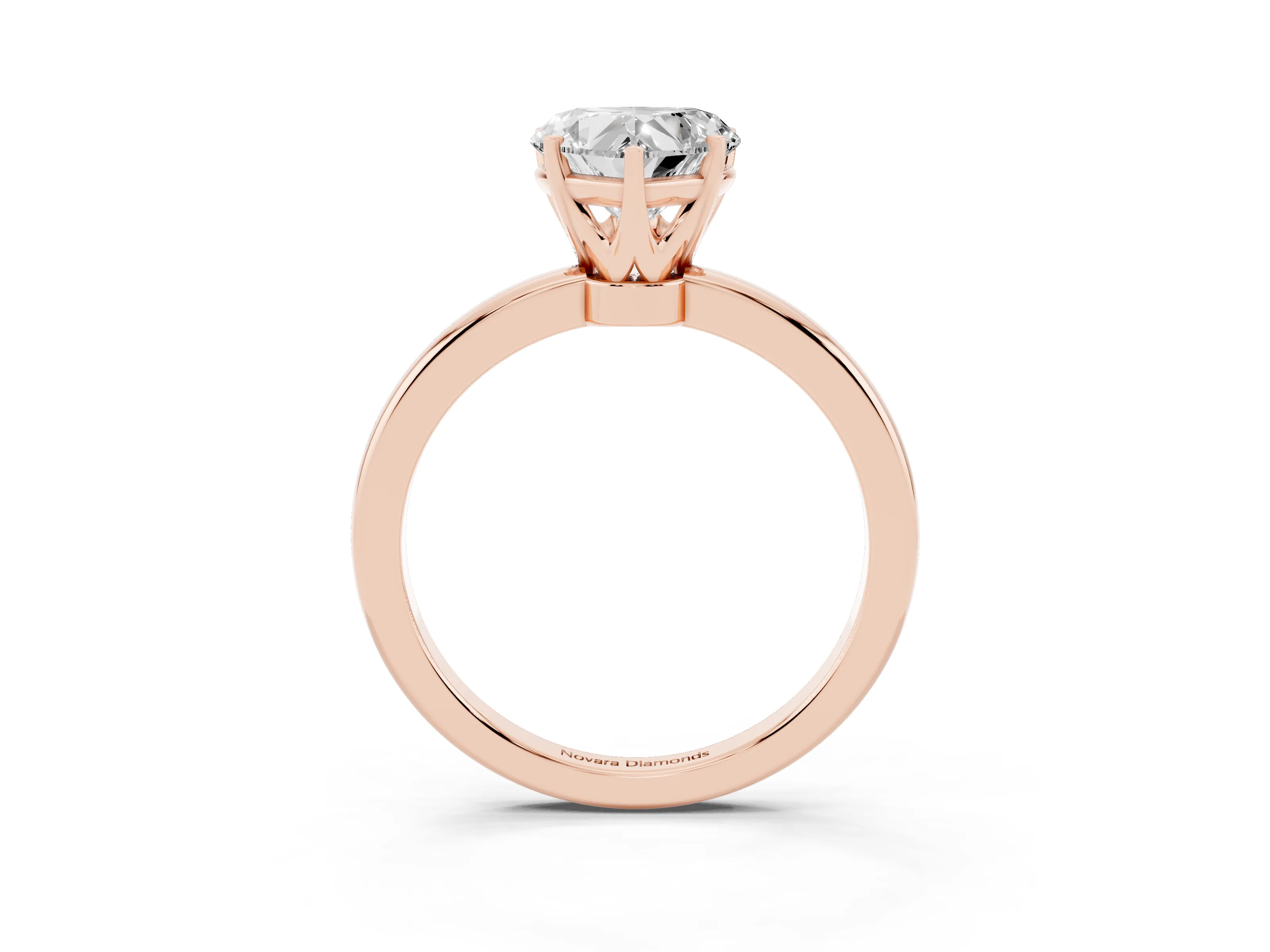 Heart Cut Diamond Solitaire Ring Set in Rose gold with Raised Prong Setting on a Classic Band