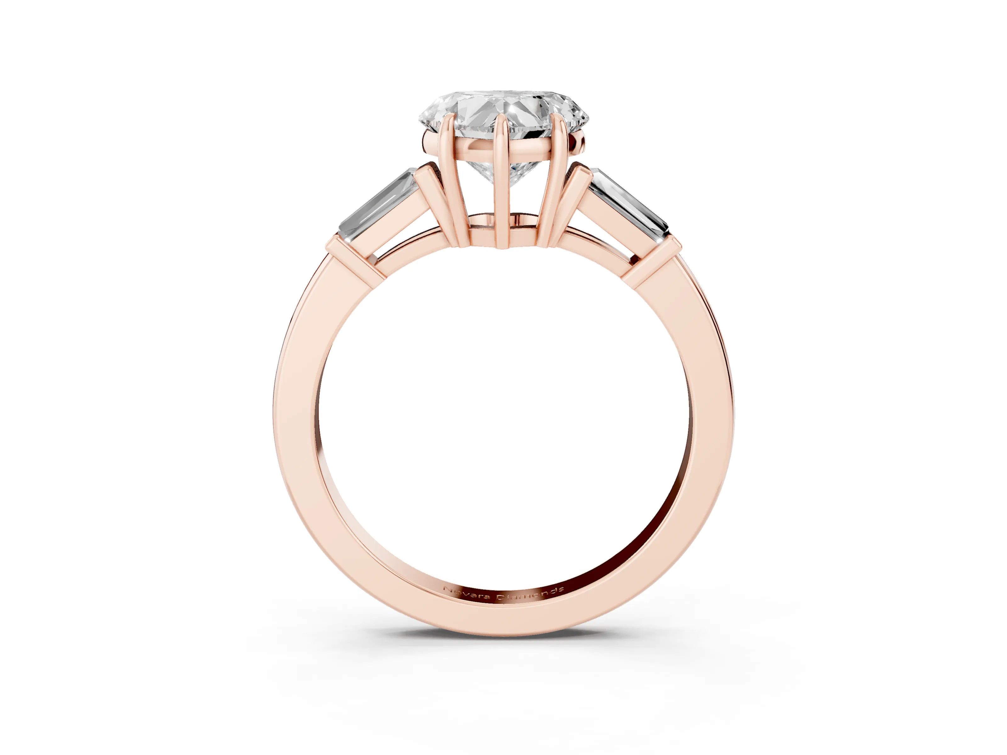 Heart Cut Diamond Three-Stone Ring Set in Rose gold with Tapered Baguette Side Stones and Prong Setting