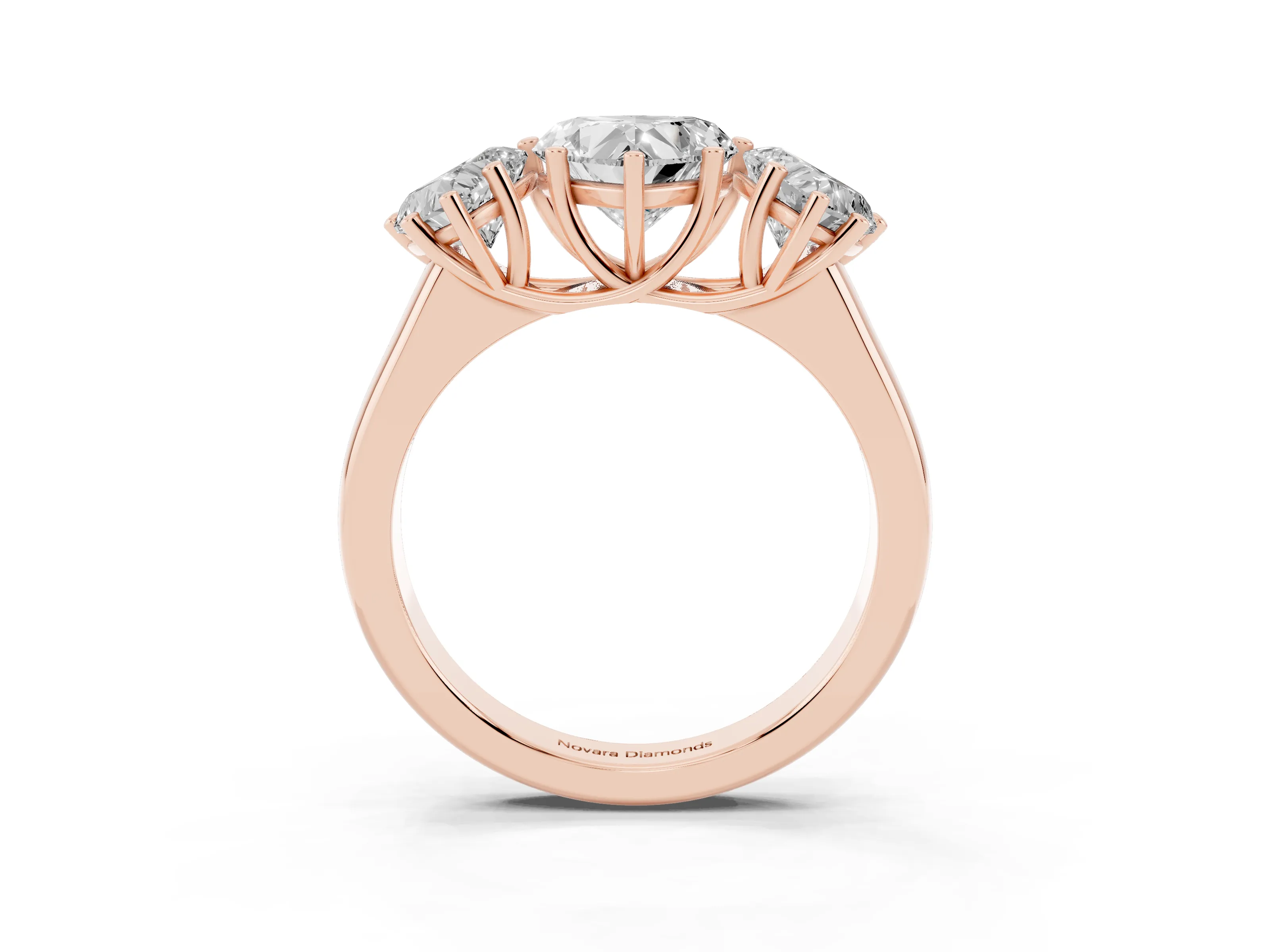 Heart Cut Diamond Three-Stone Ring Set in Rose gold with Plain Polished Band