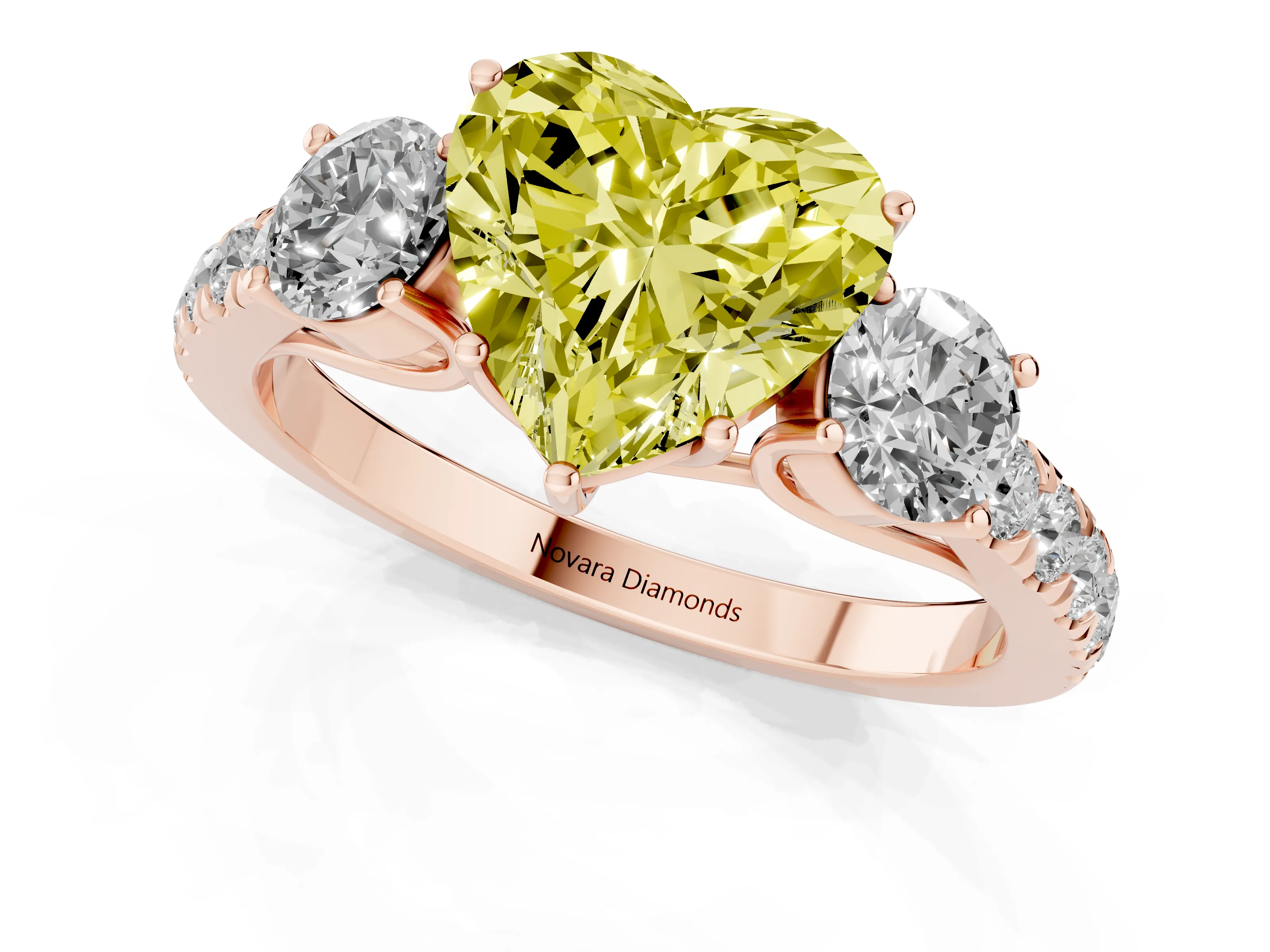 Fancy Yellow Heart Cut Diamond Three-Stone Ring Set in Rose gold with Round Side Stones and Delicate Pavé Band