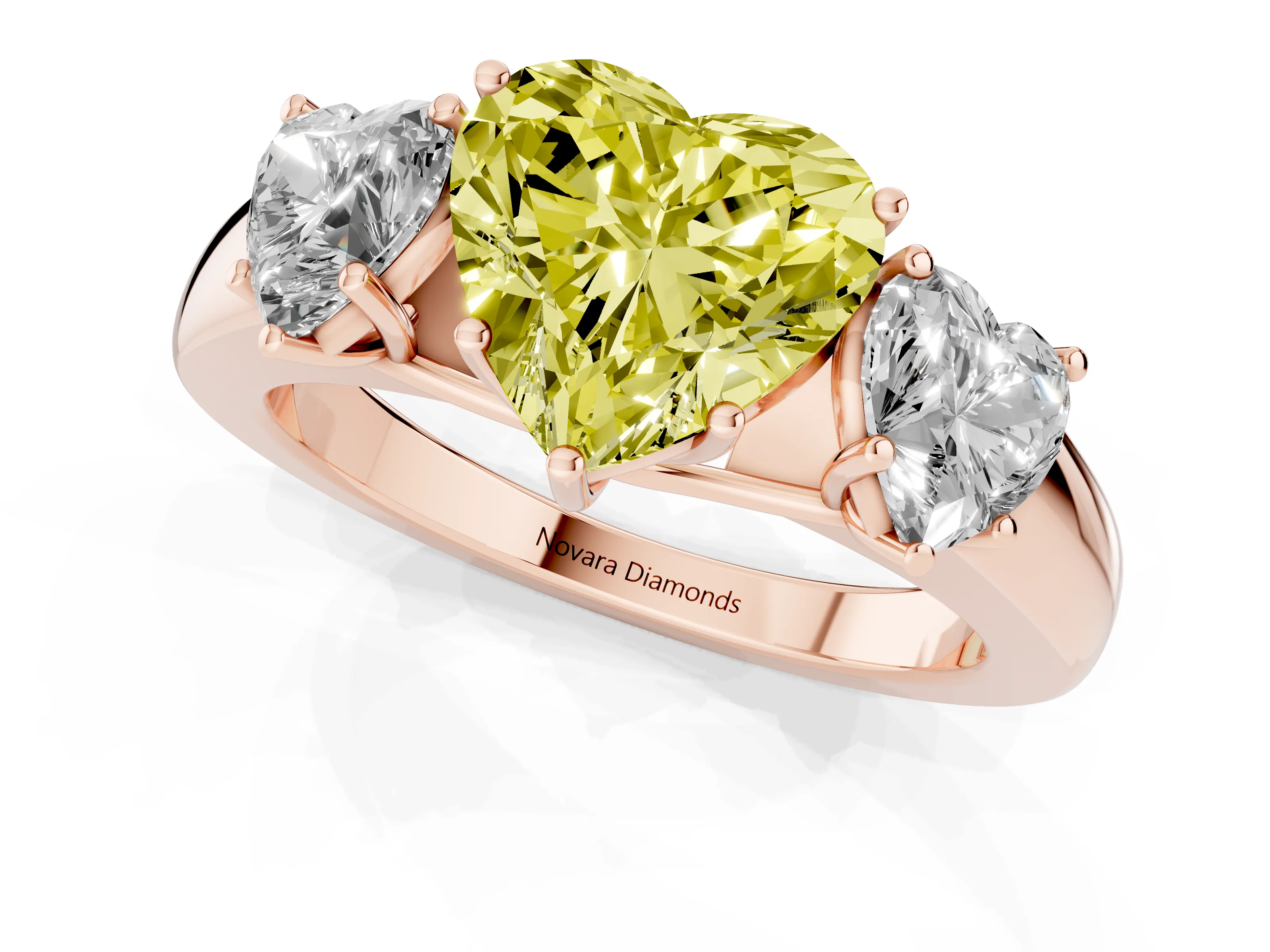 Fancy Yellow Three-Stone Heart Cut Diamond Ring Set in Rose gold with Matching Prong Settings and Plain Band