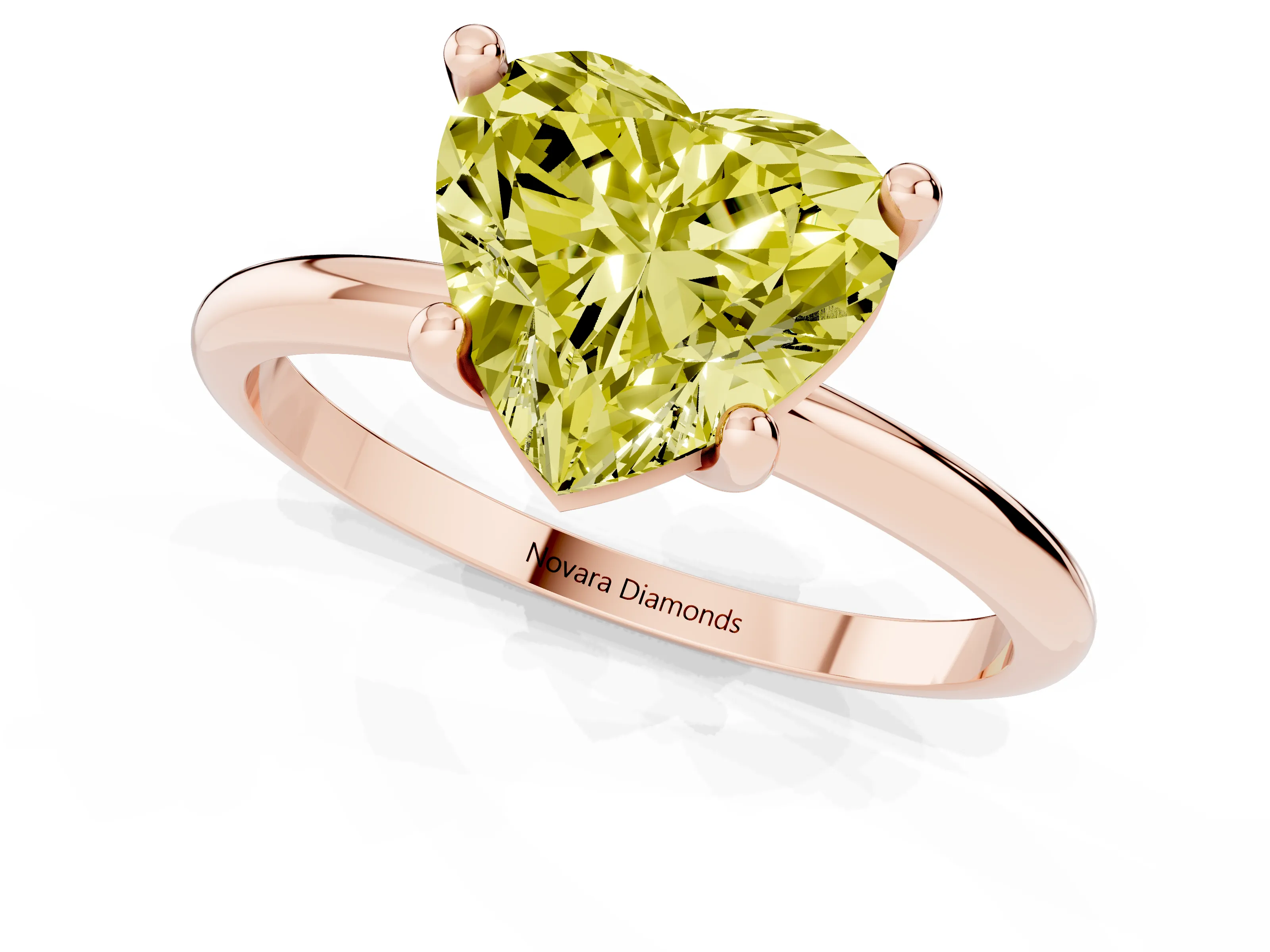 Fancy Yellow Heart Cut Diamond Solitaire Ring Set in Rose gold with Secure Prong Setting on a Classic Band