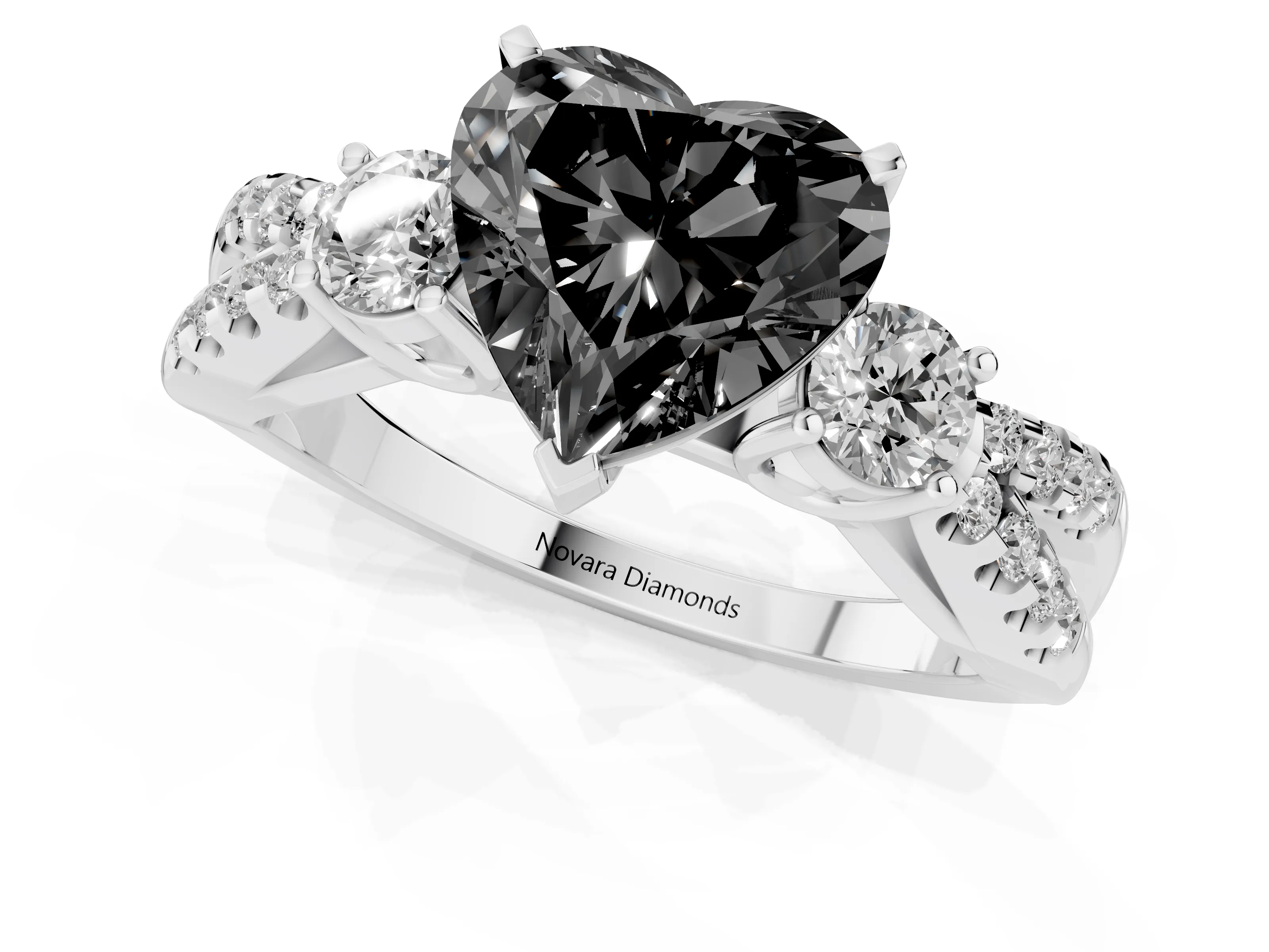 Fancy Black Heart Cut Diamond Three-Stone Ring Set in White gold with Pavé Split Shank and Prong Setting