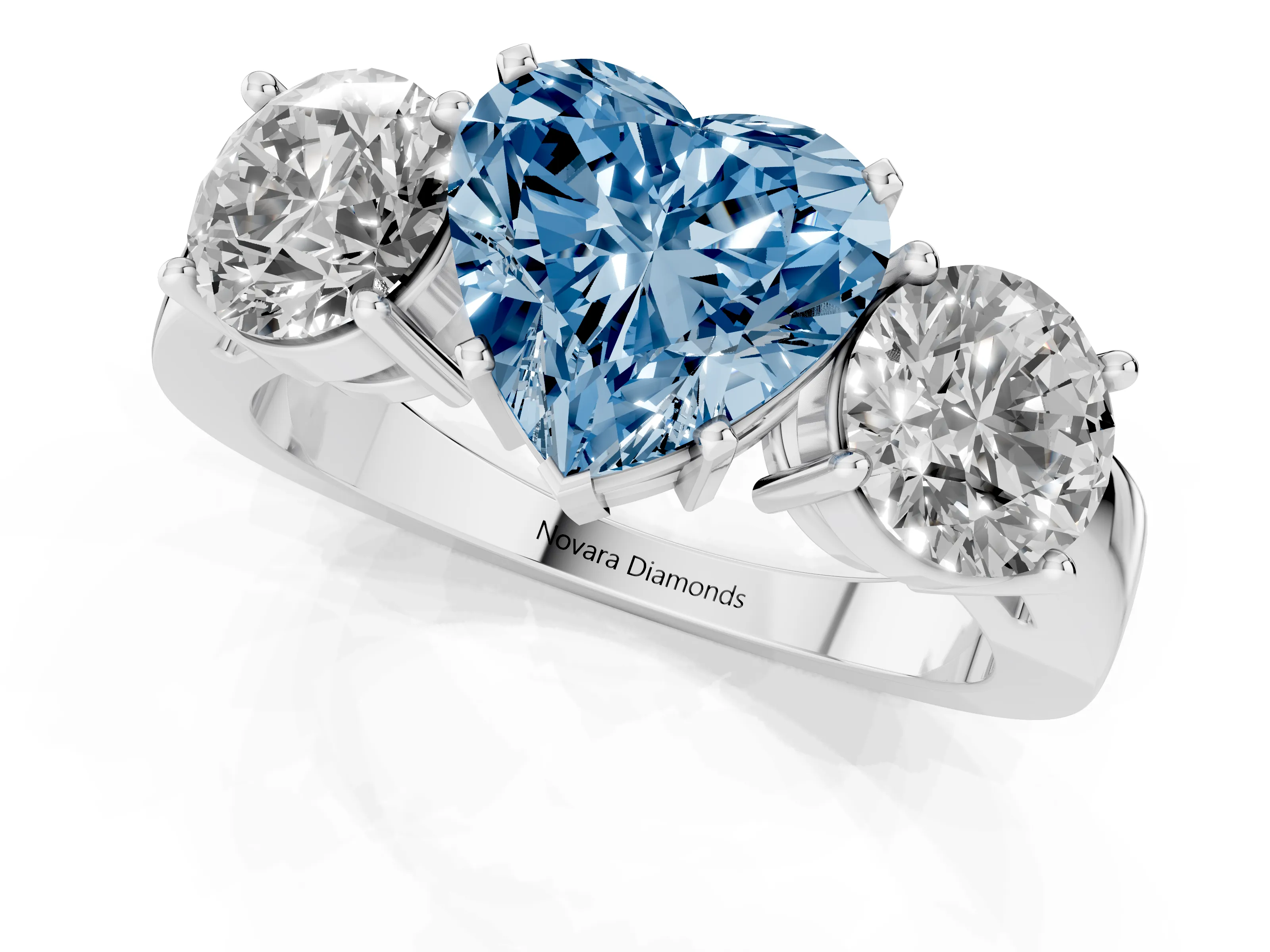 Fancy Blue Heart Cut Diamond Three-Stone Ring Set in Platinum with Round Side Stones and Classic Band