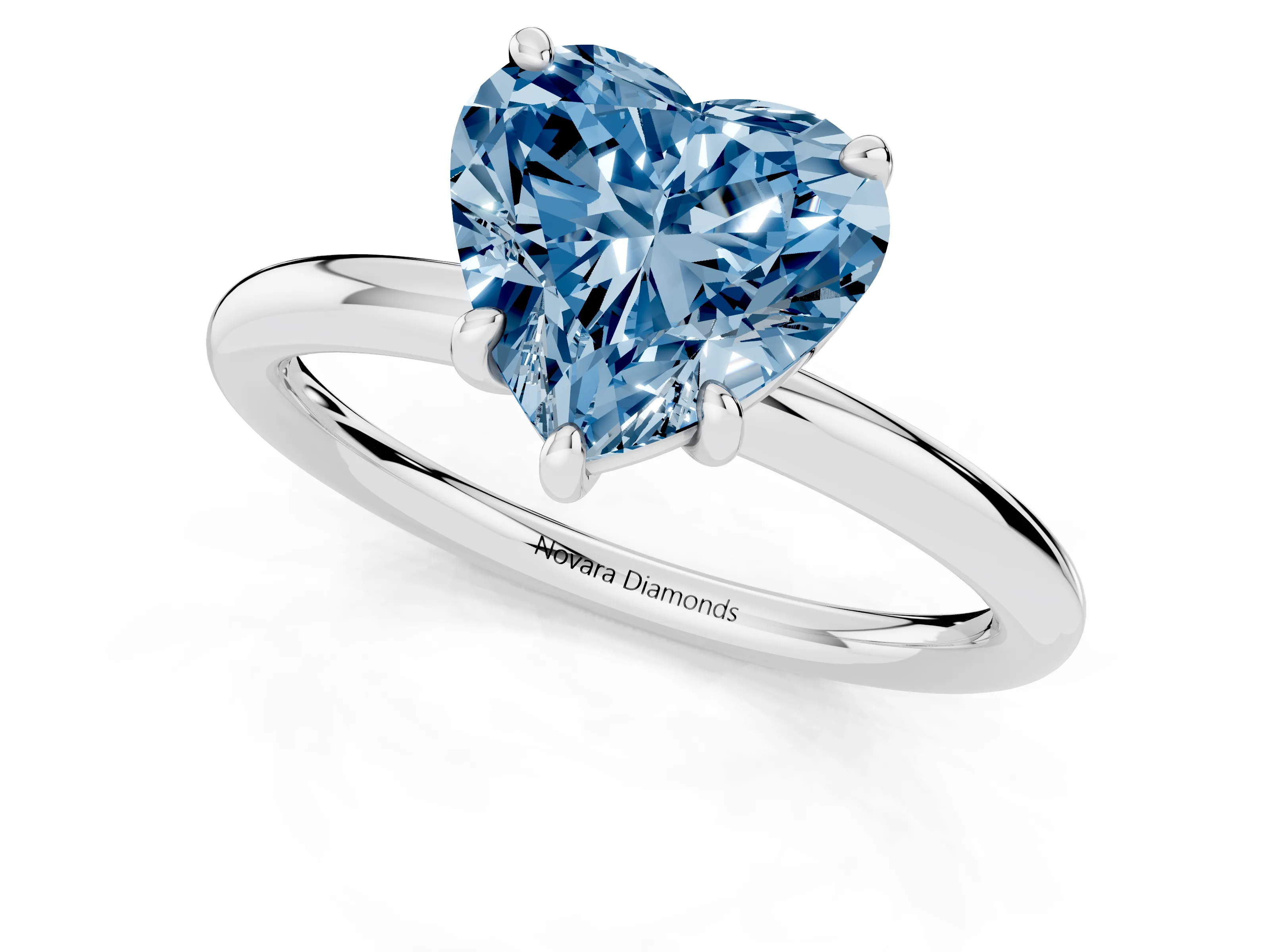 Fancy Blue Heart Cut Diamond Solitaire Ring Set in Platinum with Prong Setting on a Polished Plain Band
