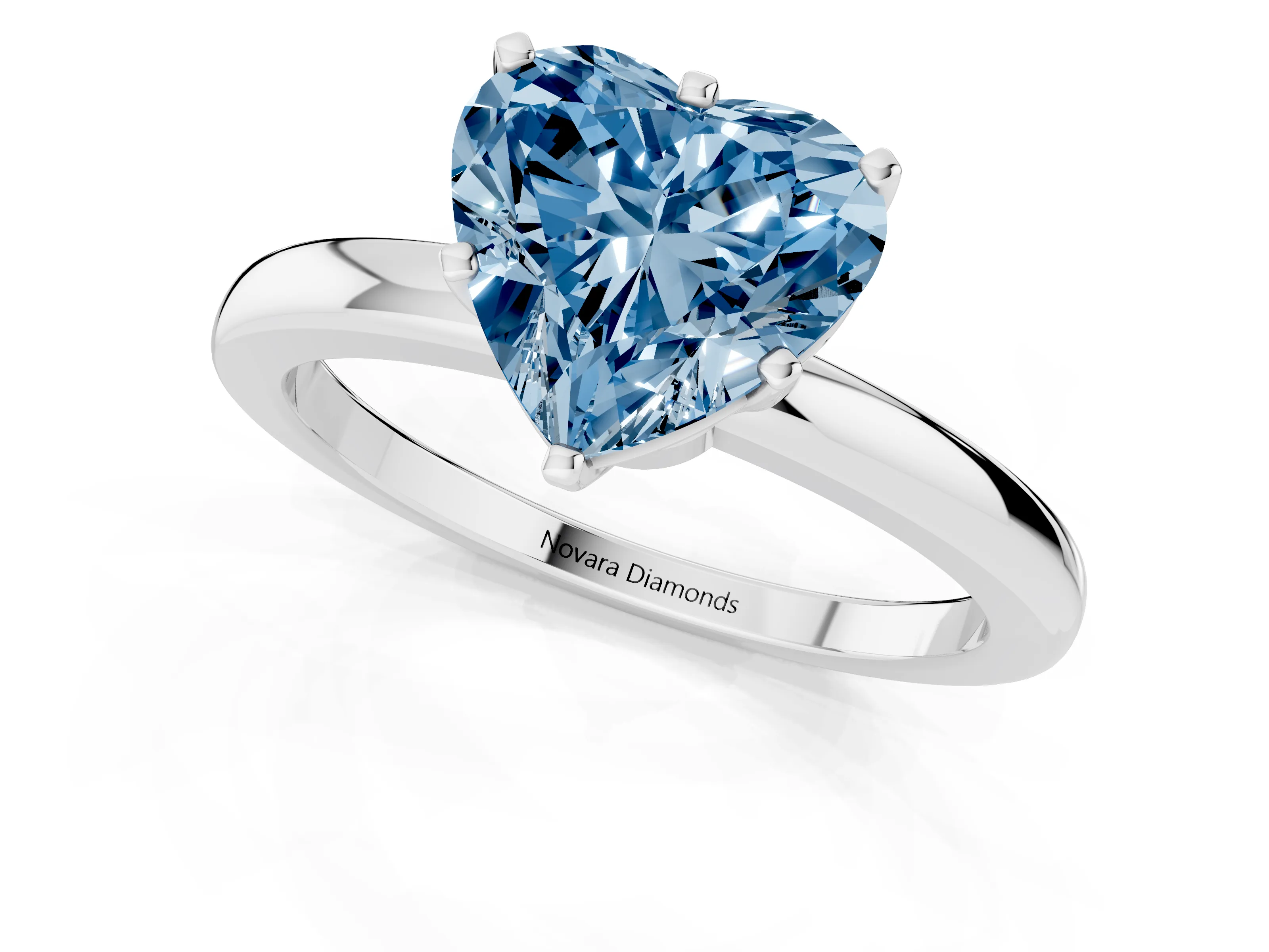 Fancy Blue Heart Cut Diamond Solitaire Ring Set in Silver with Raised Prong Setting on a Classic Band