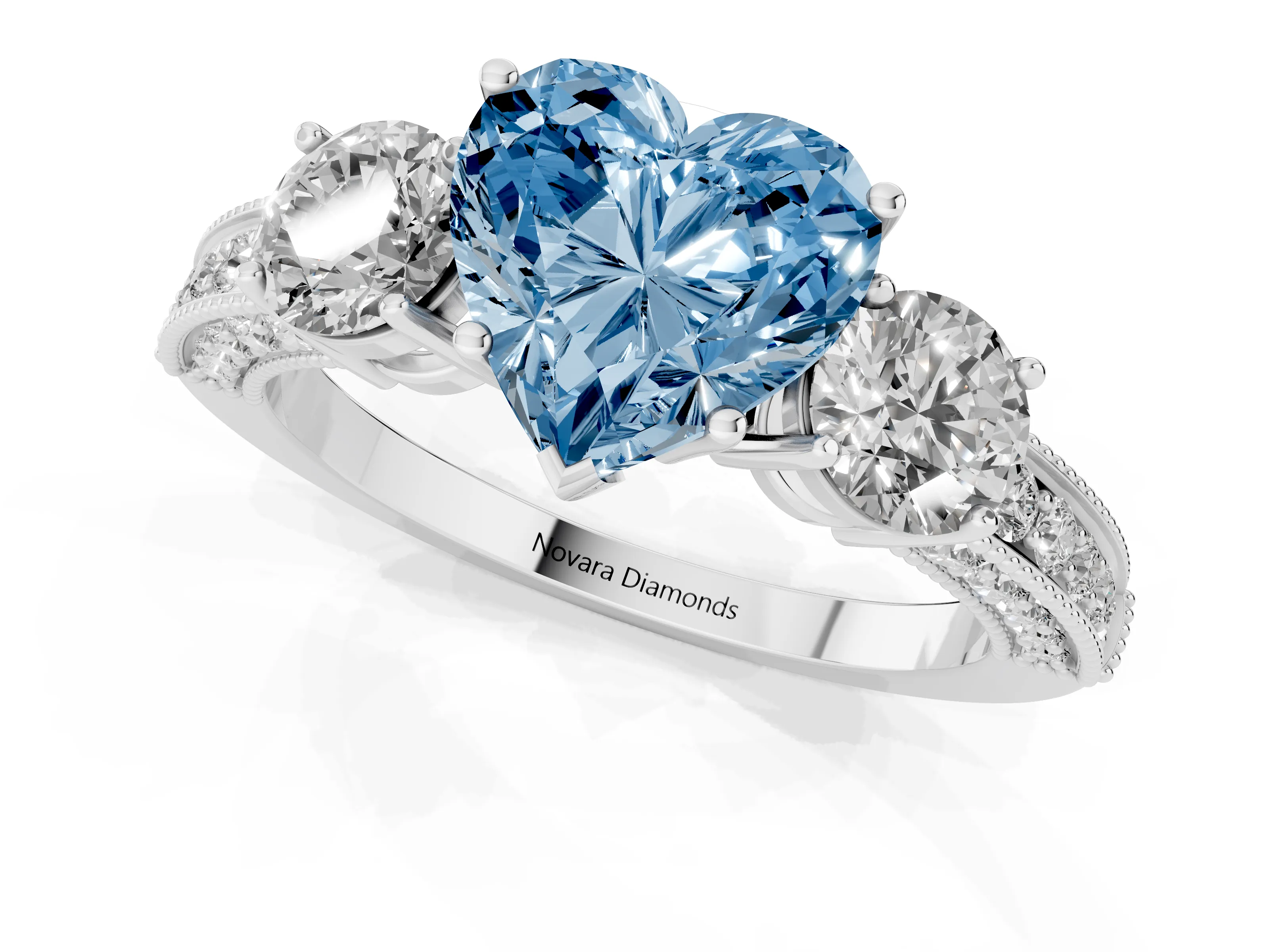 Fancy Blue Heart Cut Diamond Three-Stone Ring Set in White gold with Round Side Stones and Pavé Band