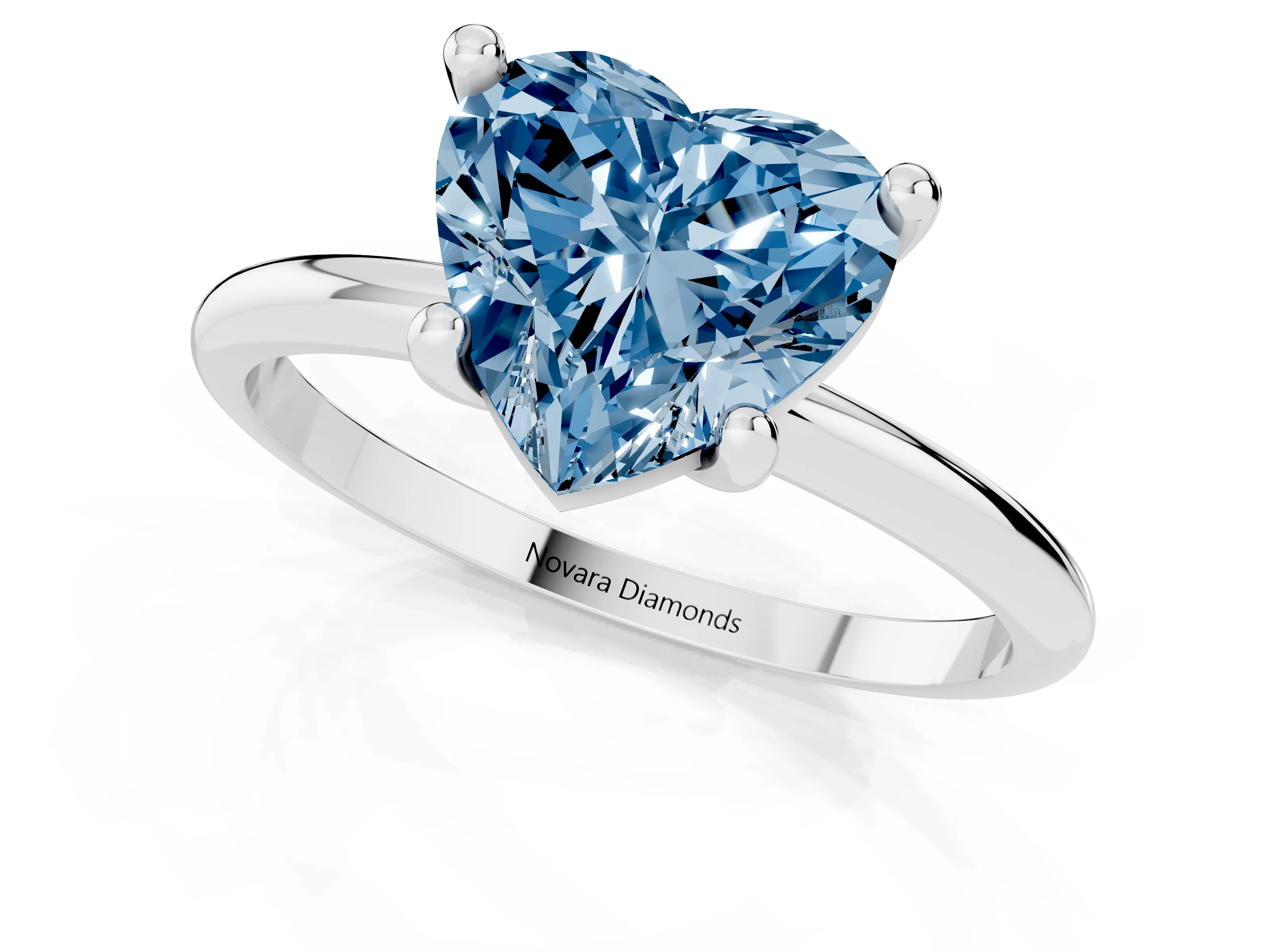 Fancy Blue Heart Cut Diamond Solitaire Ring Set in Platinum with Secure Prong Setting on a Classic Band