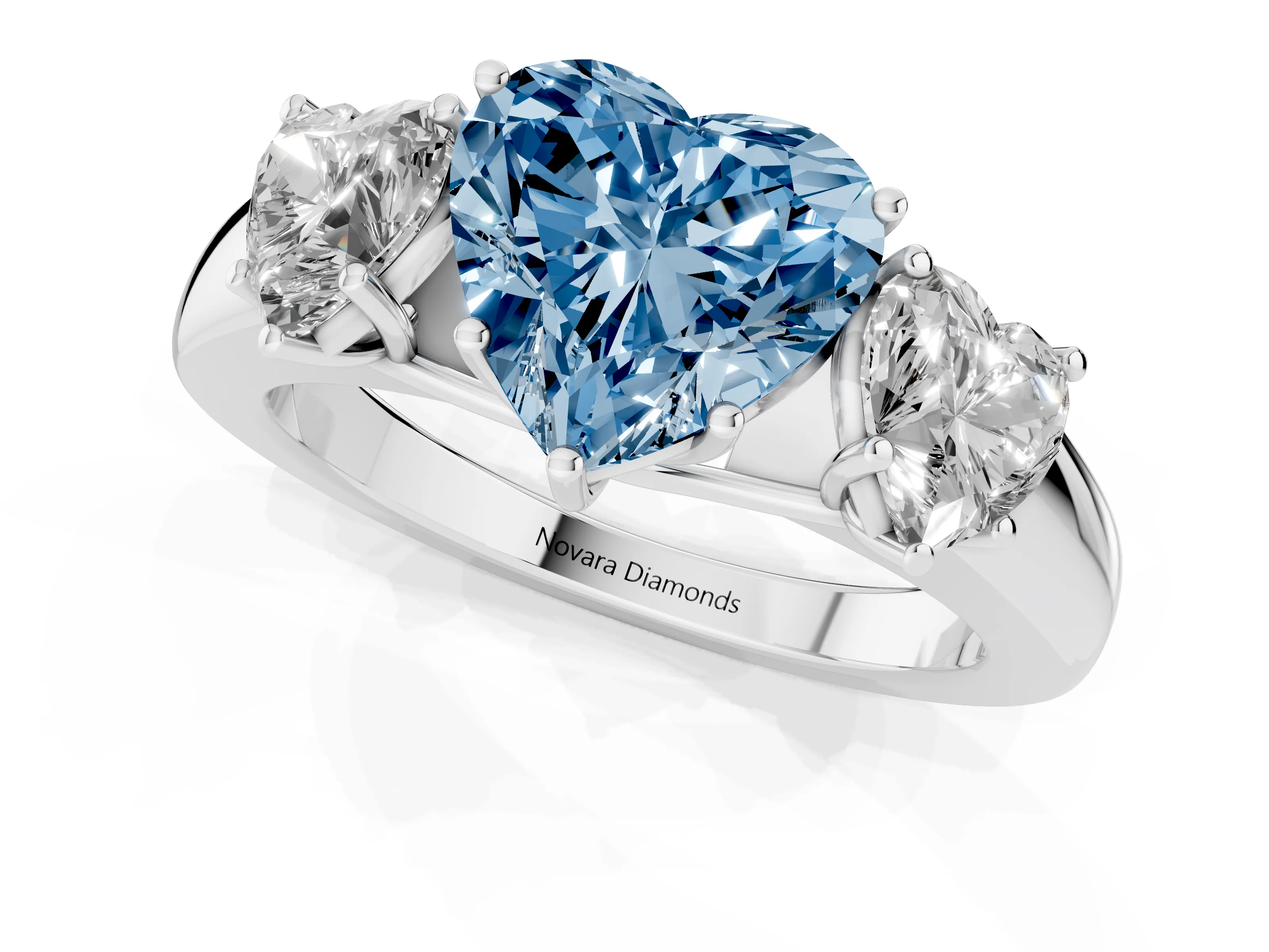 Fancy Blue Three-Stone Heart Cut Diamond Ring Set in Silver with Matching Prong Settings and Plain Band