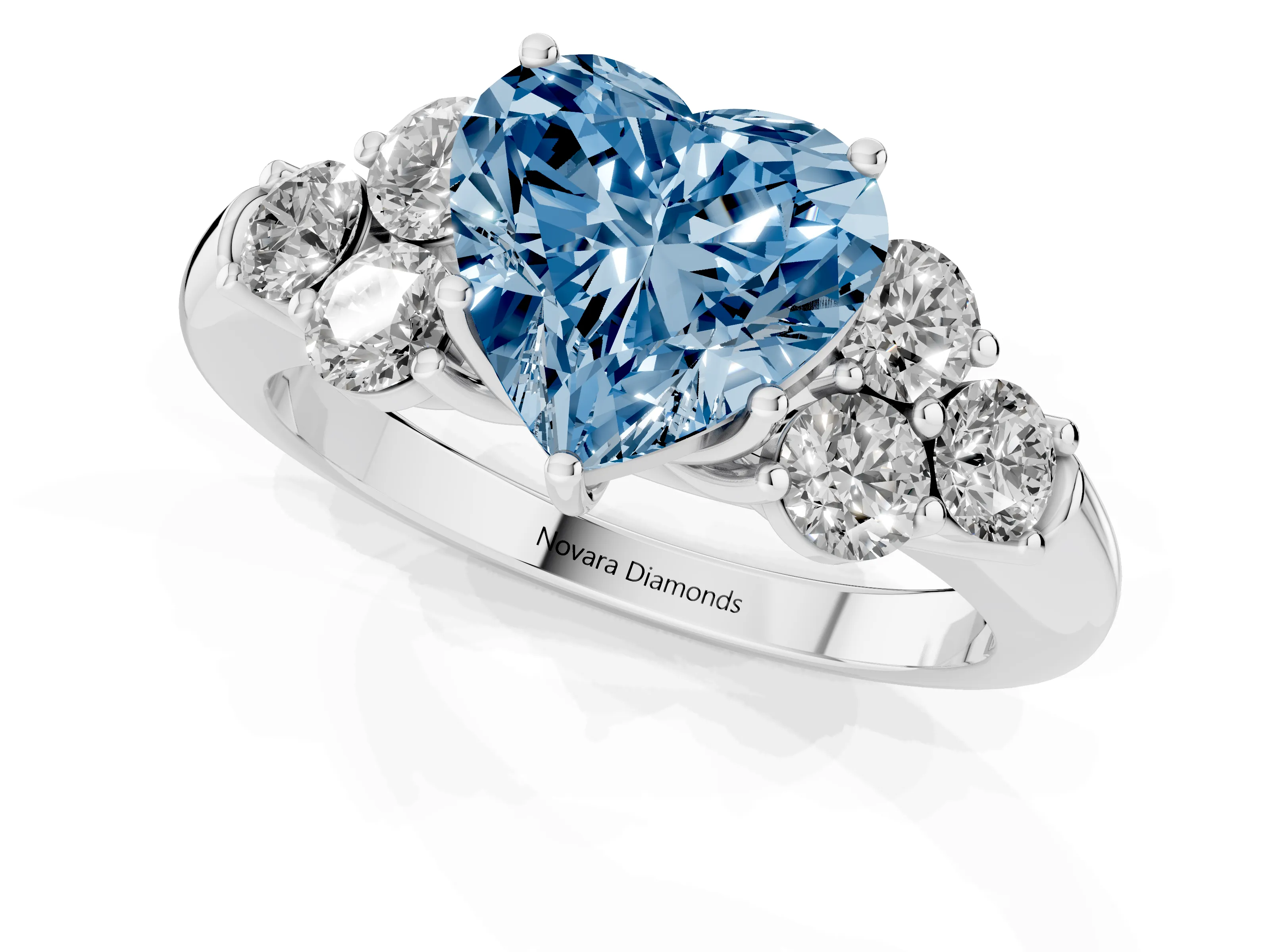 Fancy Blue Heart Cut Diamond Cluster Ring Set in Platinum with Round Accent Stones and Prong Setting on a Plain Band