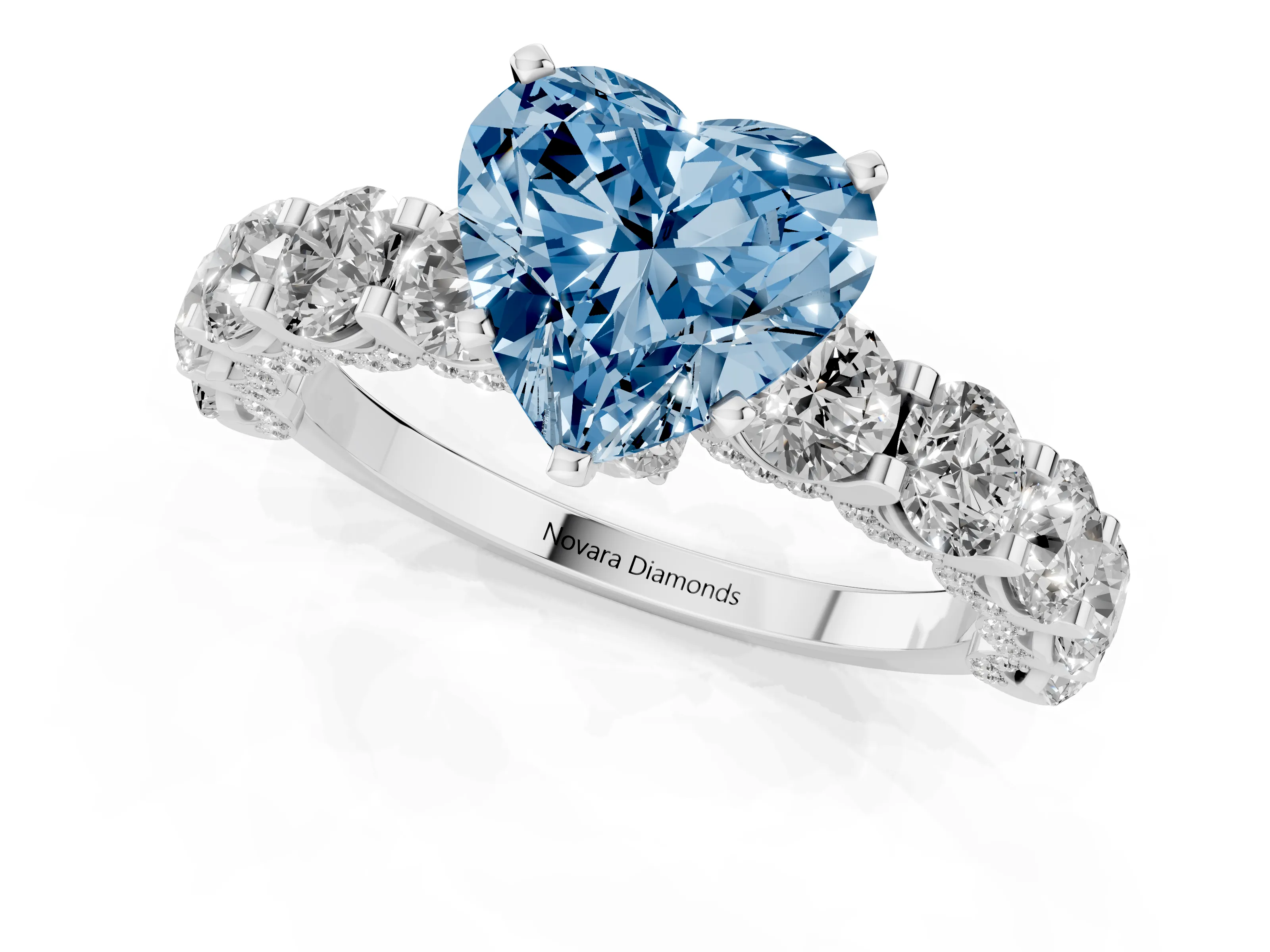 Fancy Blue Heart Cut Diamond Side Stone Ring Set in Silver with Alternating Round and Oval Side Stones