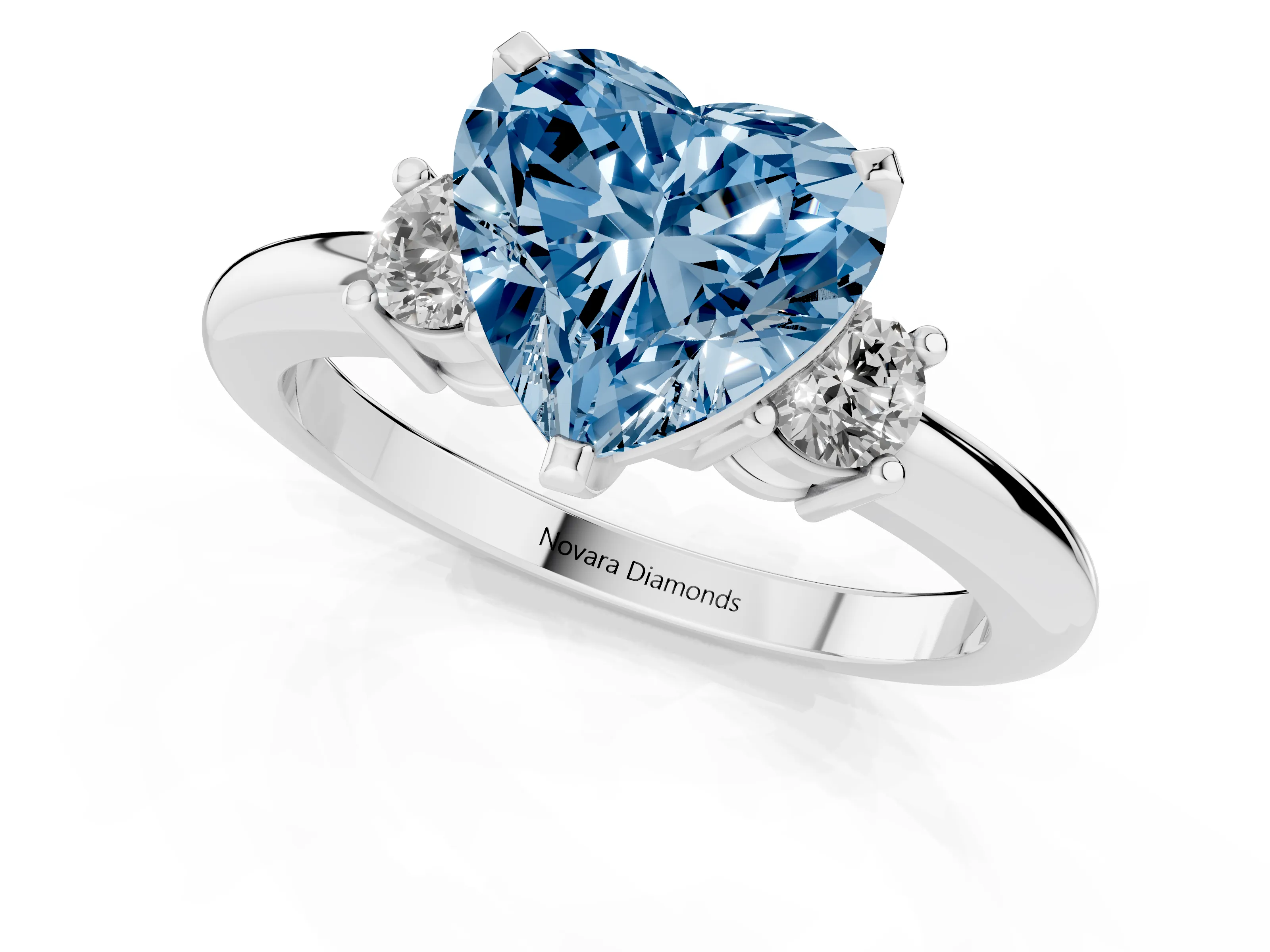 Fancy Blue Three-Stone Heart Cut Diamond Ring Set in White gold with Prong Setting and Plain Band