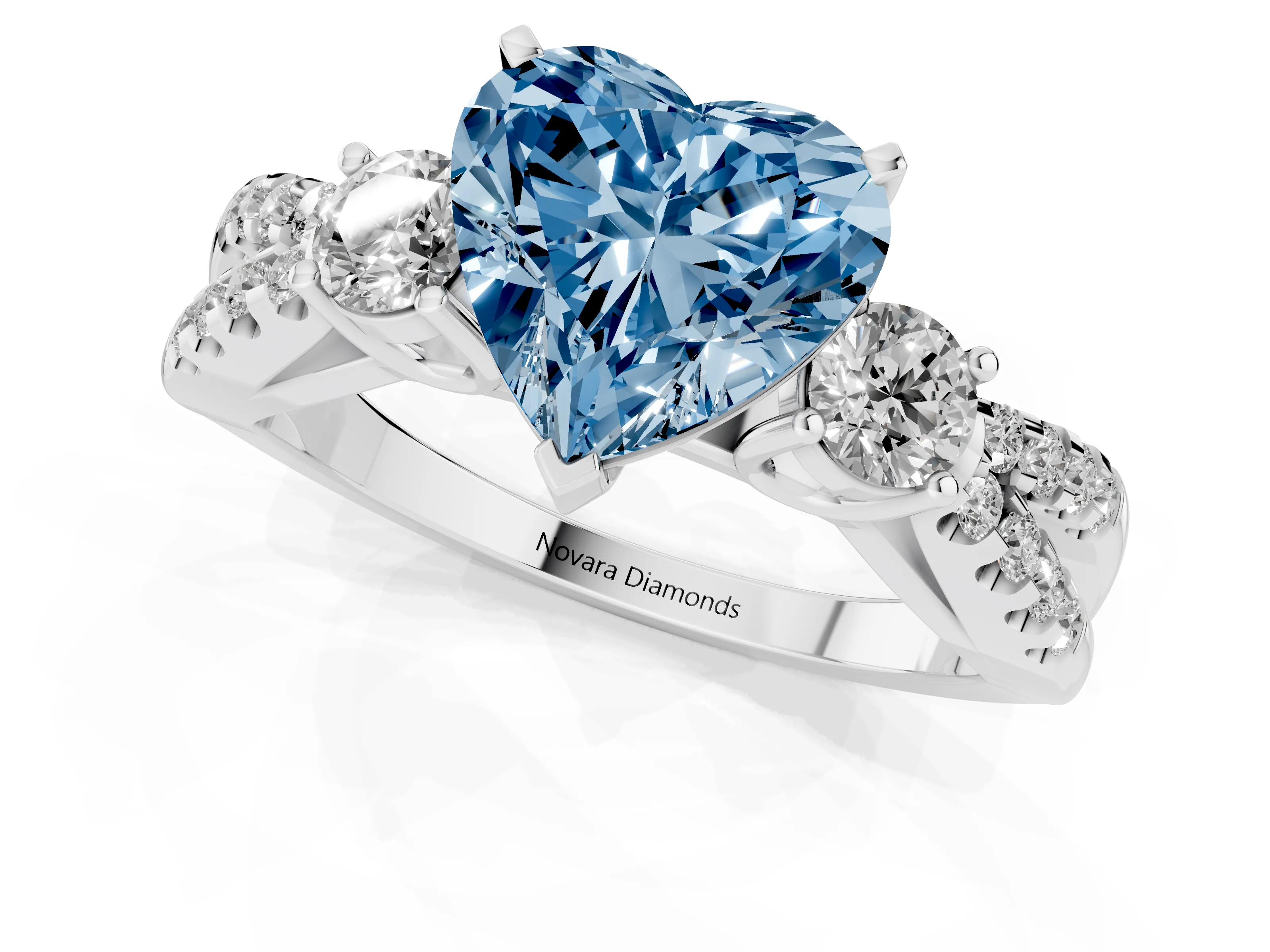 Fancy Blue Heart Cut Diamond Three-Stone Ring Set in White gold with Pavé Split Shank and Prong Setting