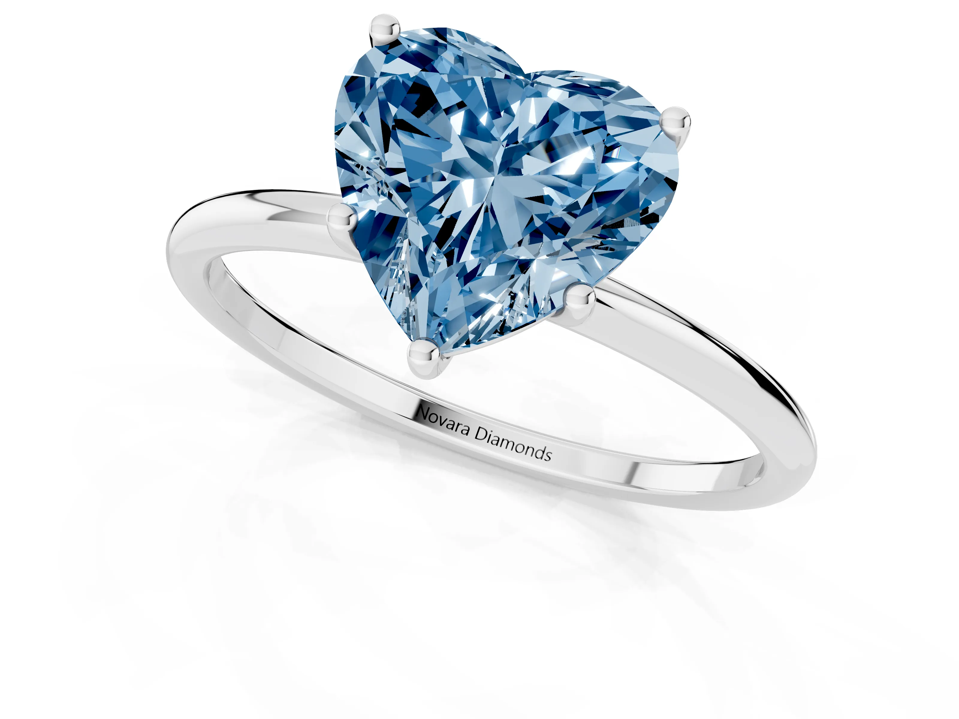 Fancy Blue Heart Cut Diamond Solitaire Engagement Ring Set in Platinum with Thin Band and Prong Setting