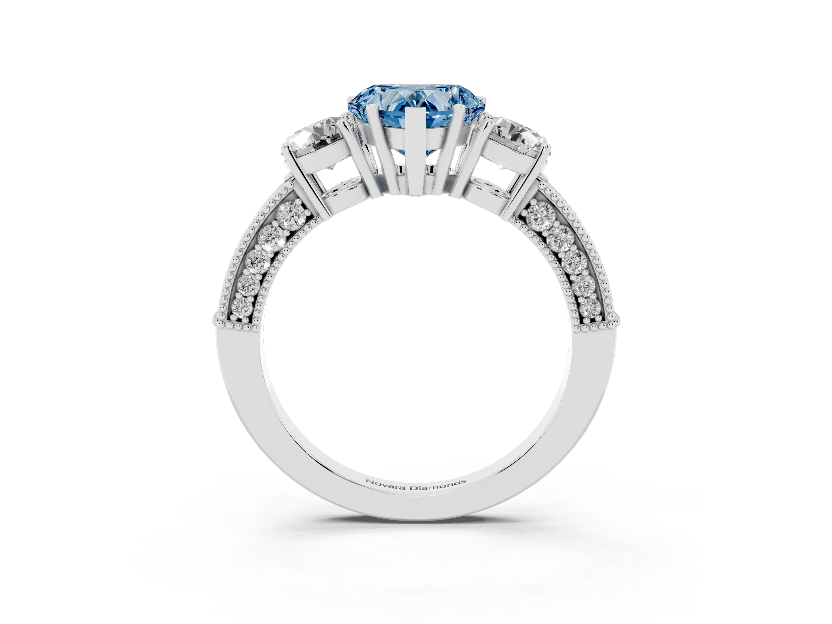 Fancy Blue Heart Cut Diamond Three-Stone Ring Set in White gold with Round Side Stones and Pavé Band