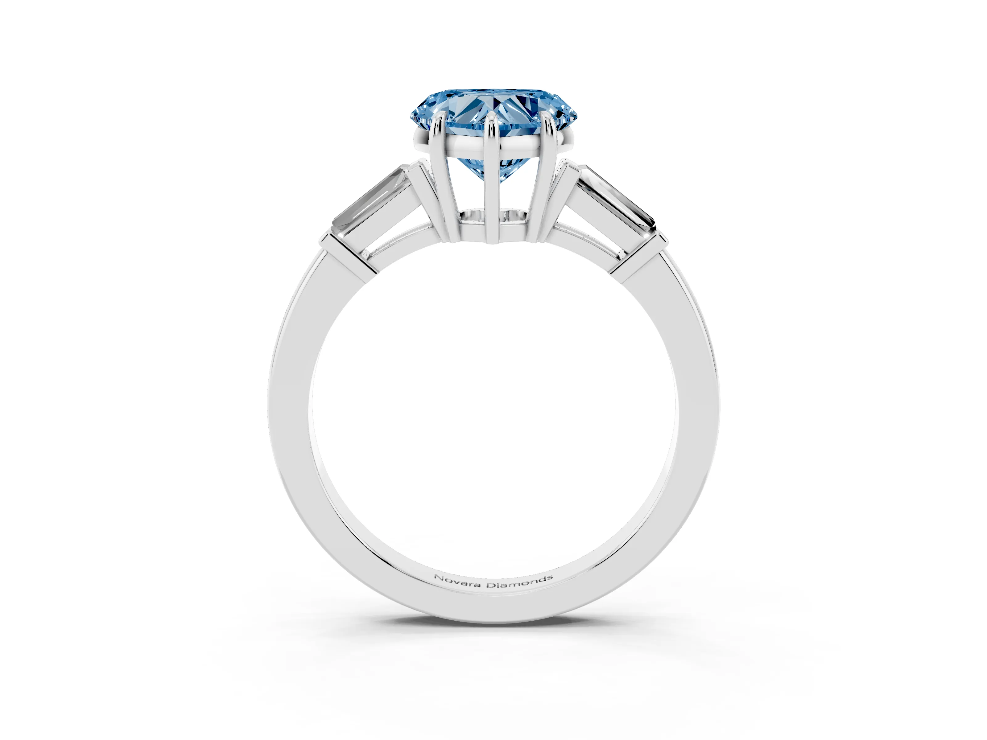 Fancy Blue Heart Cut Diamond Three-Stone Ring Set in Platinum with Tapered Baguette Side Stones and Prong Setting