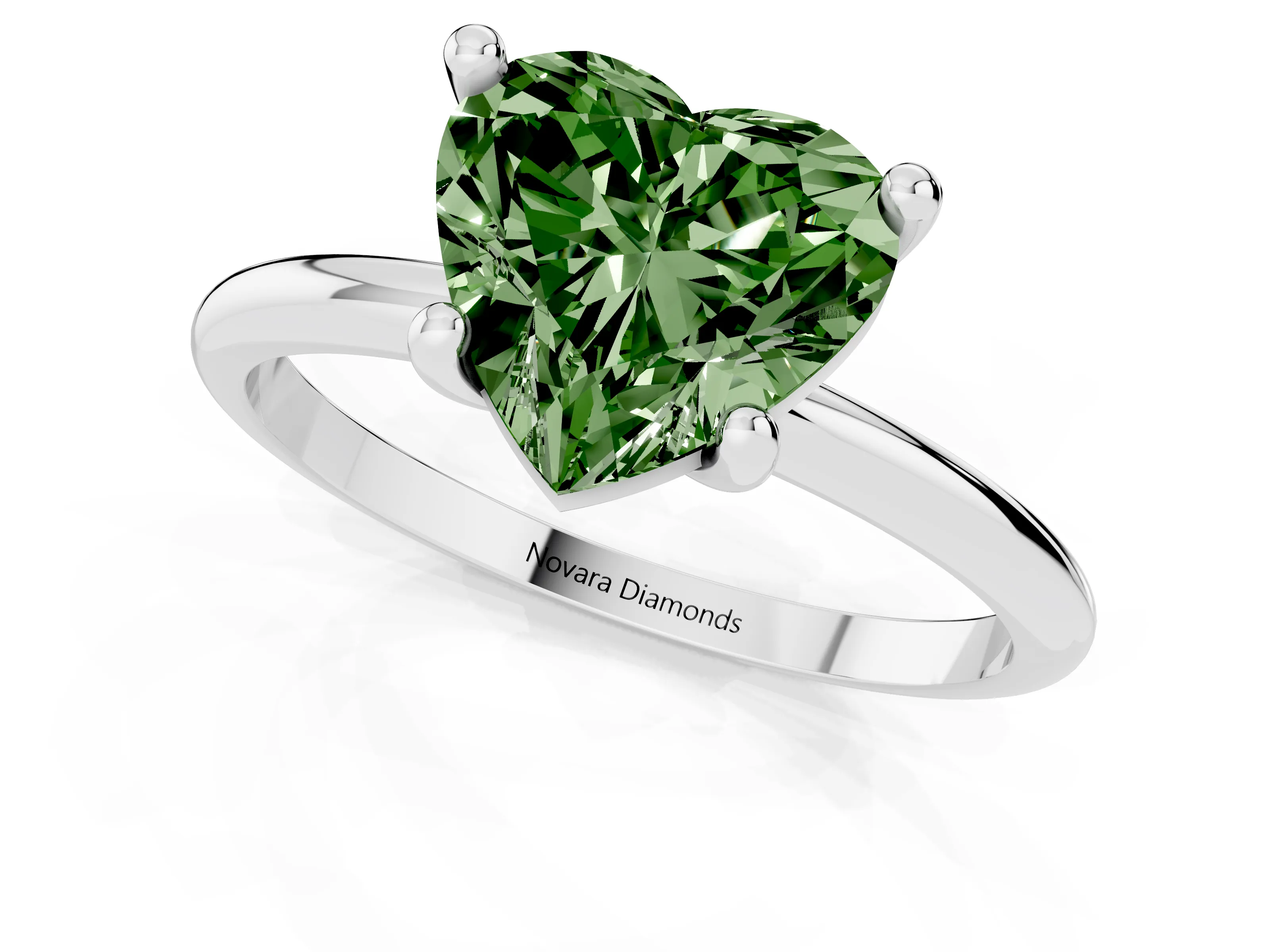 Fancy Green Heart Cut Diamond Solitaire Ring Set in Silver with Secure Prong Setting on a Classic Band