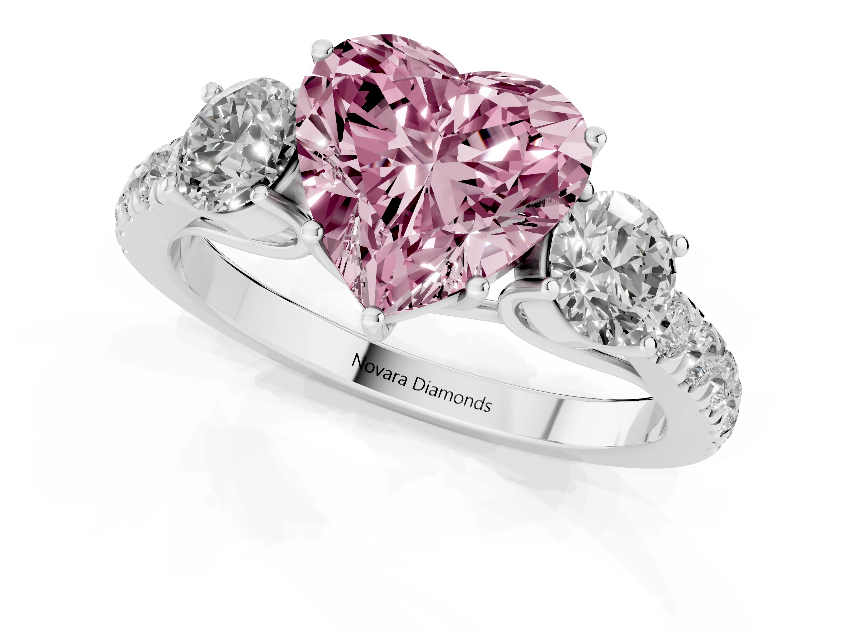 Fancy Pink Heart Cut Diamond Three-Stone Ring Set in White gold with Round Side Stones and Delicate Pavé Band