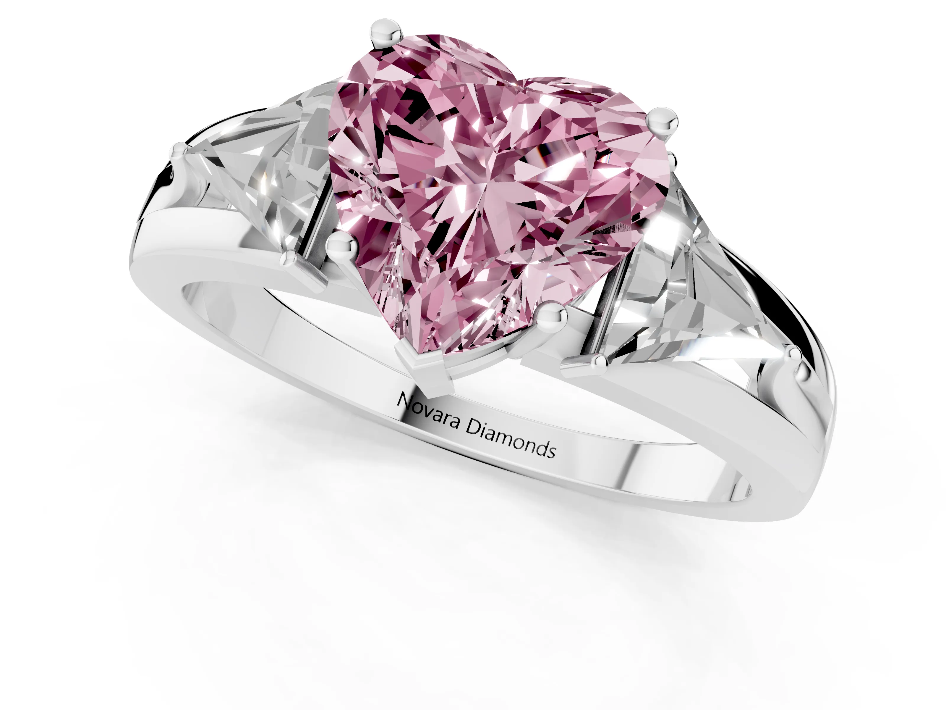 Fancy Pink Heart Cut Diamond Three-Stone Ring Set in Platinum with Trillion Side Stones and Split Shank