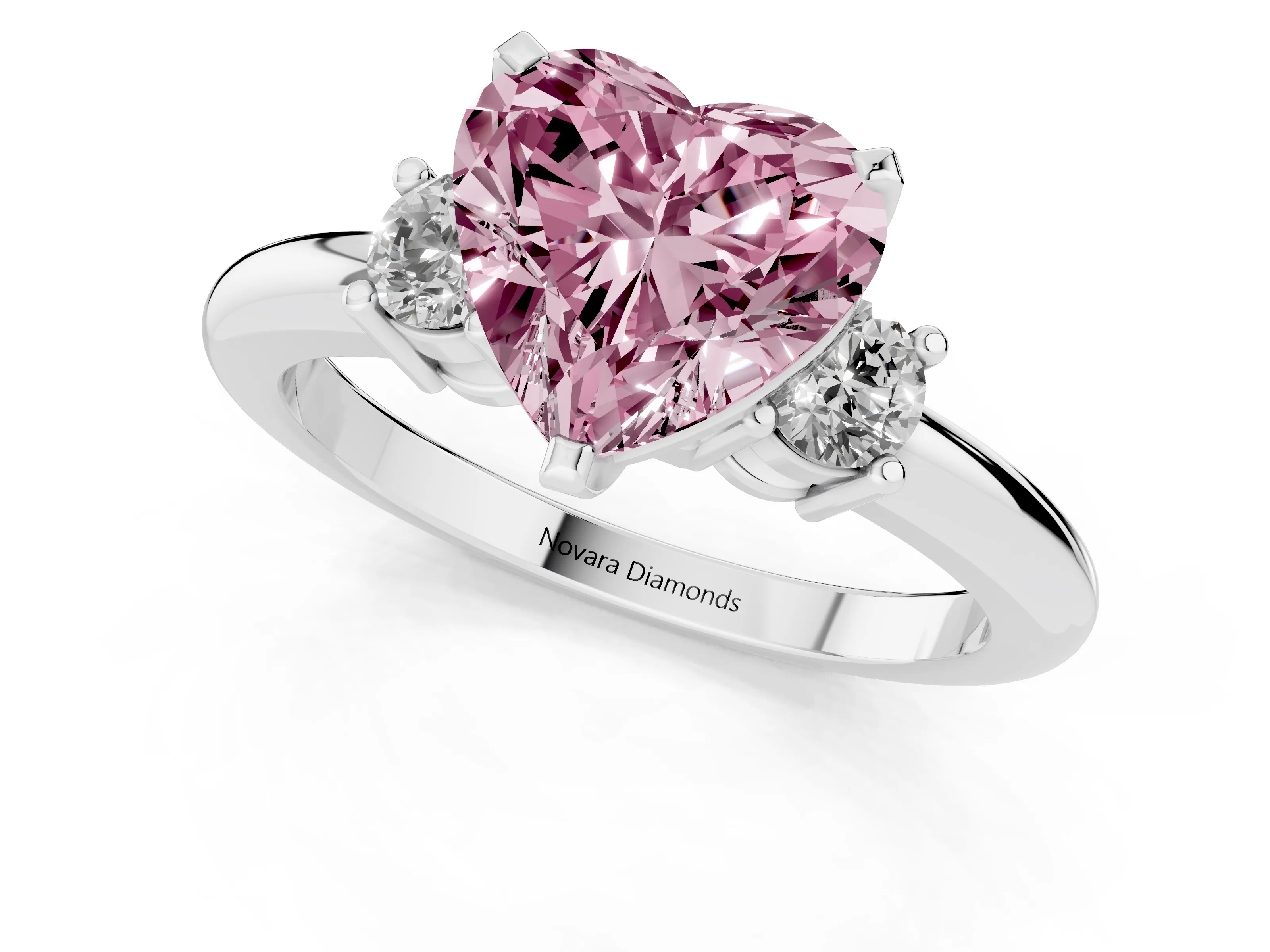 Fancy Pink Three-Stone Heart Cut Diamond Ring Set in Platinum with Prong Setting and Plain Band