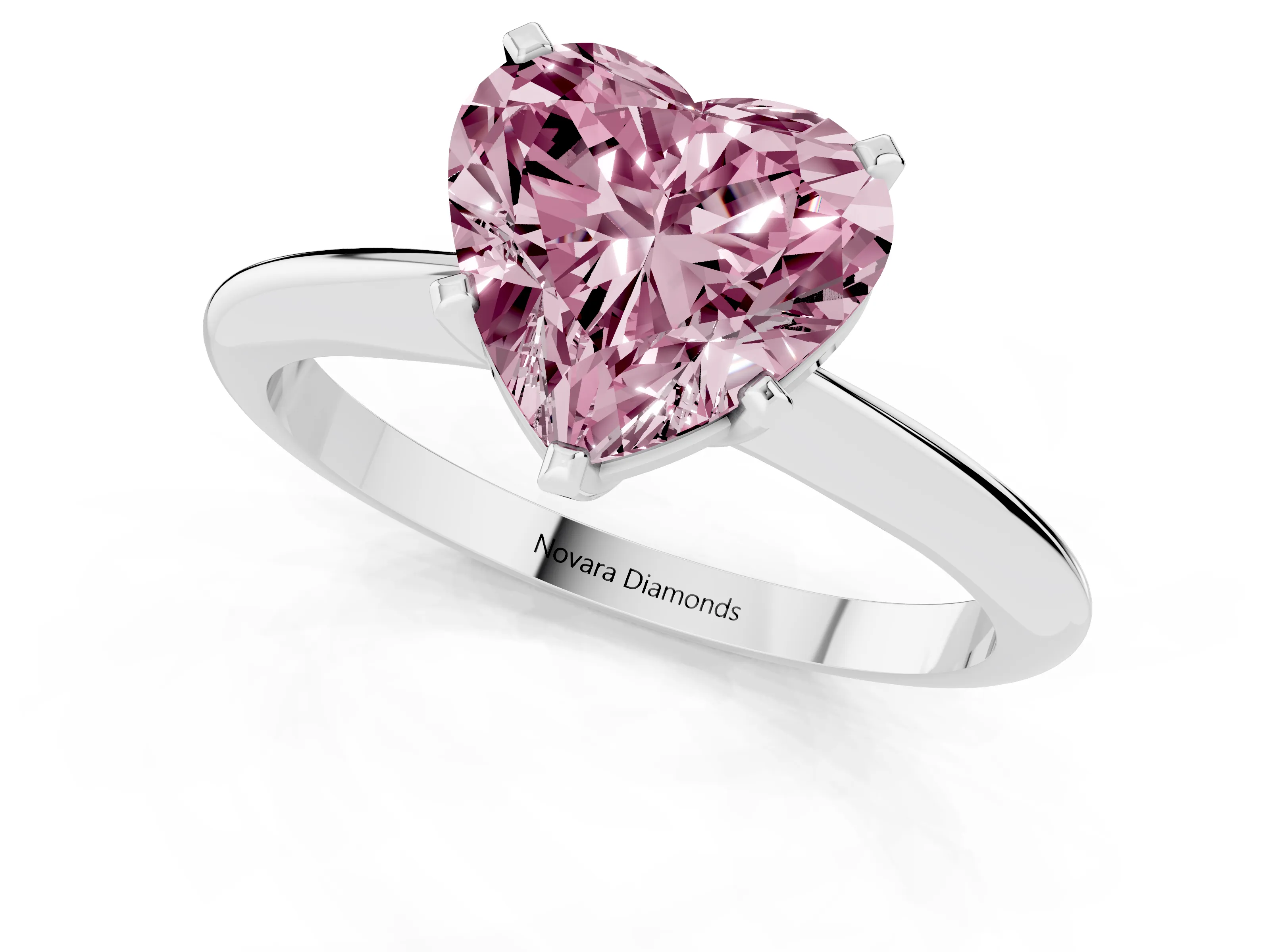 Fancy Pink Heart Cut Diamond Solitaire Ring Set in Silver with Prong Setting on a Plain Round Band