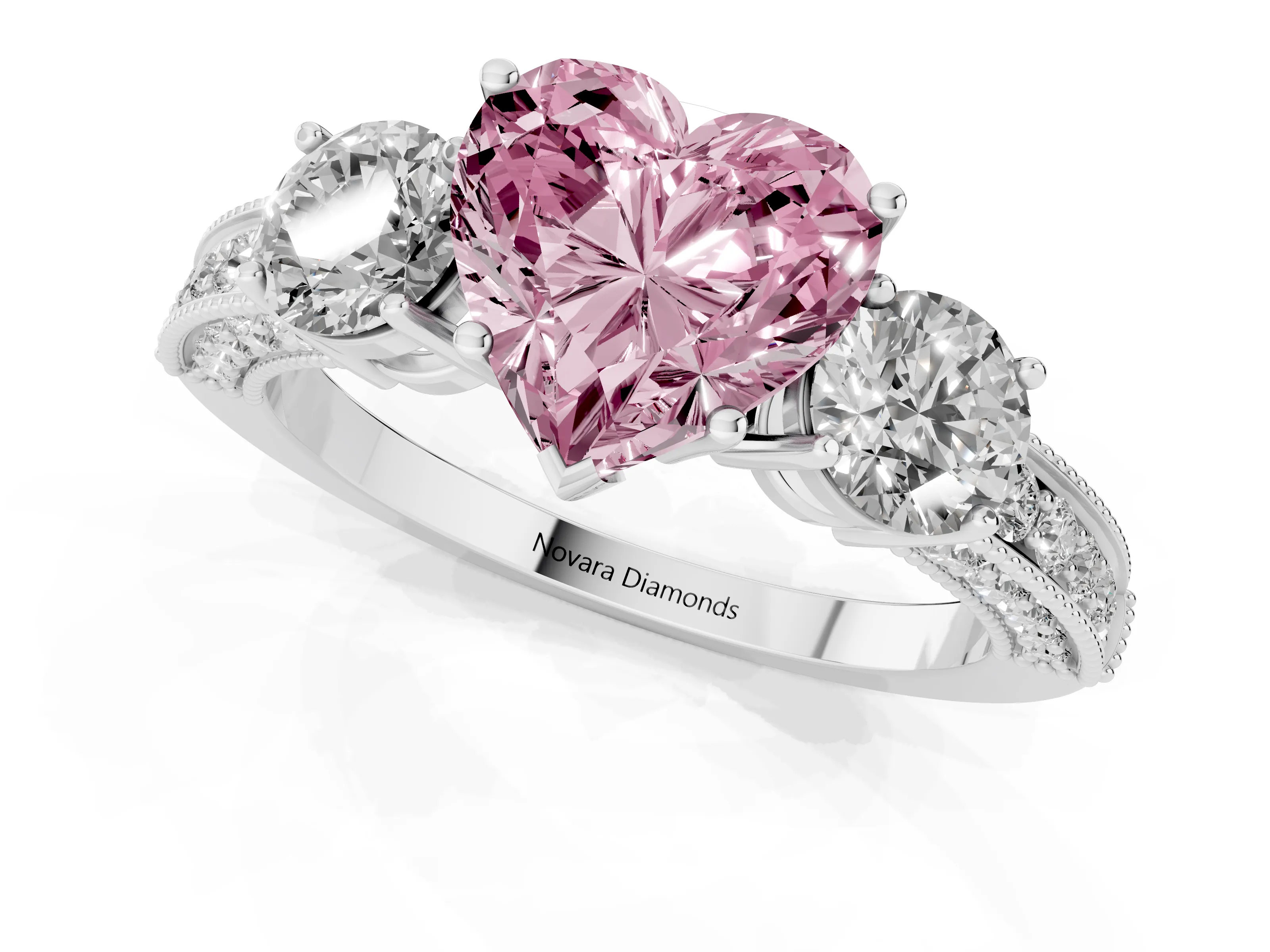 Fancy Pink Heart Cut Diamond Three-Stone Ring Set in White gold with Round Side Stones and Pavé Band