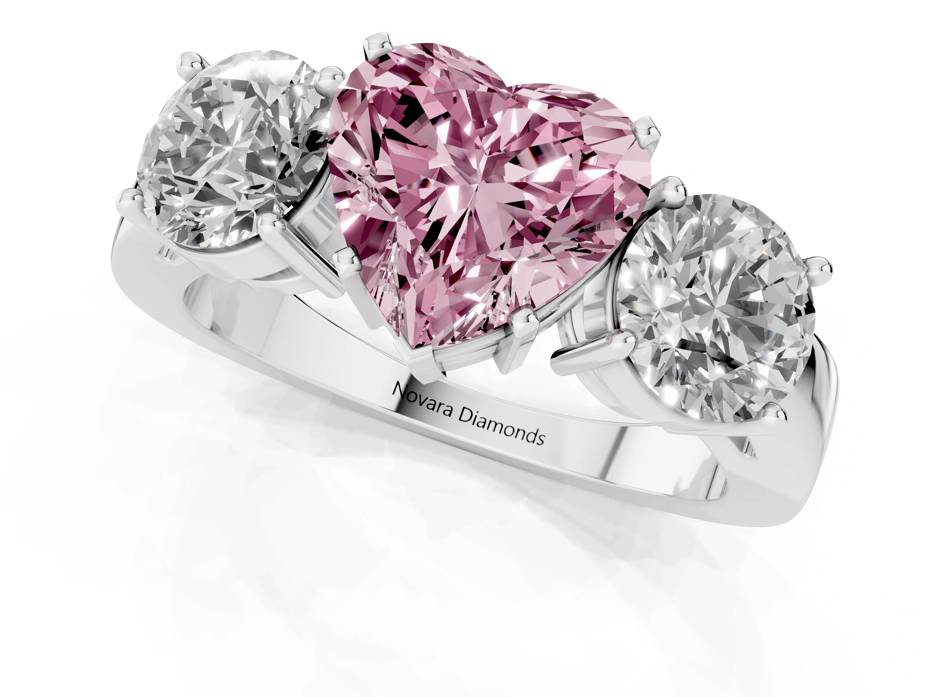 Fancy Pink Heart Cut Diamond Three-Stone Ring Set in Platinum with Round Side Stones and Classic Band