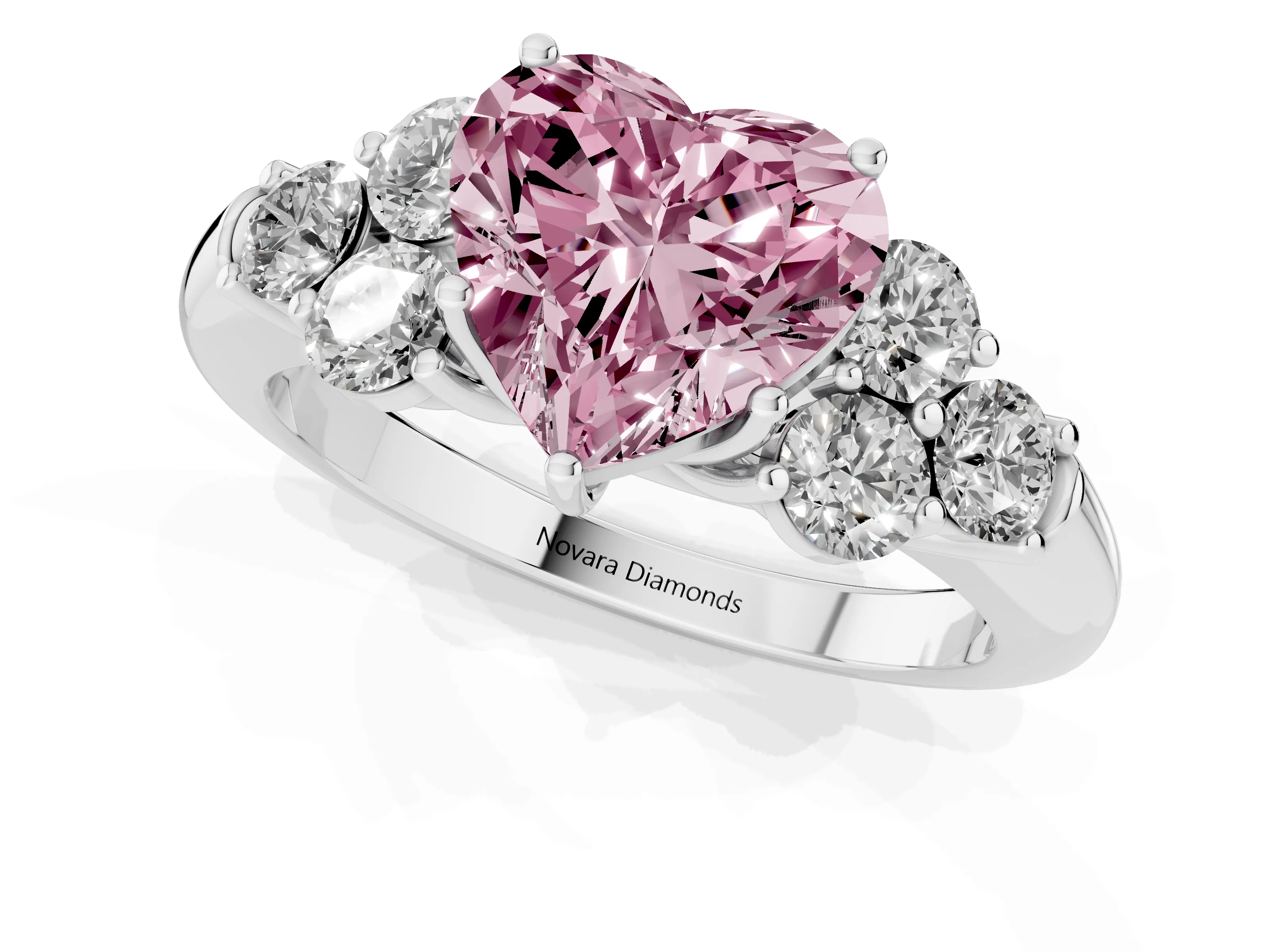 Fancy Pink Heart Cut Diamond Cluster Ring Set in Silver with Round Accent Stones and Prong Setting on a Plain Band