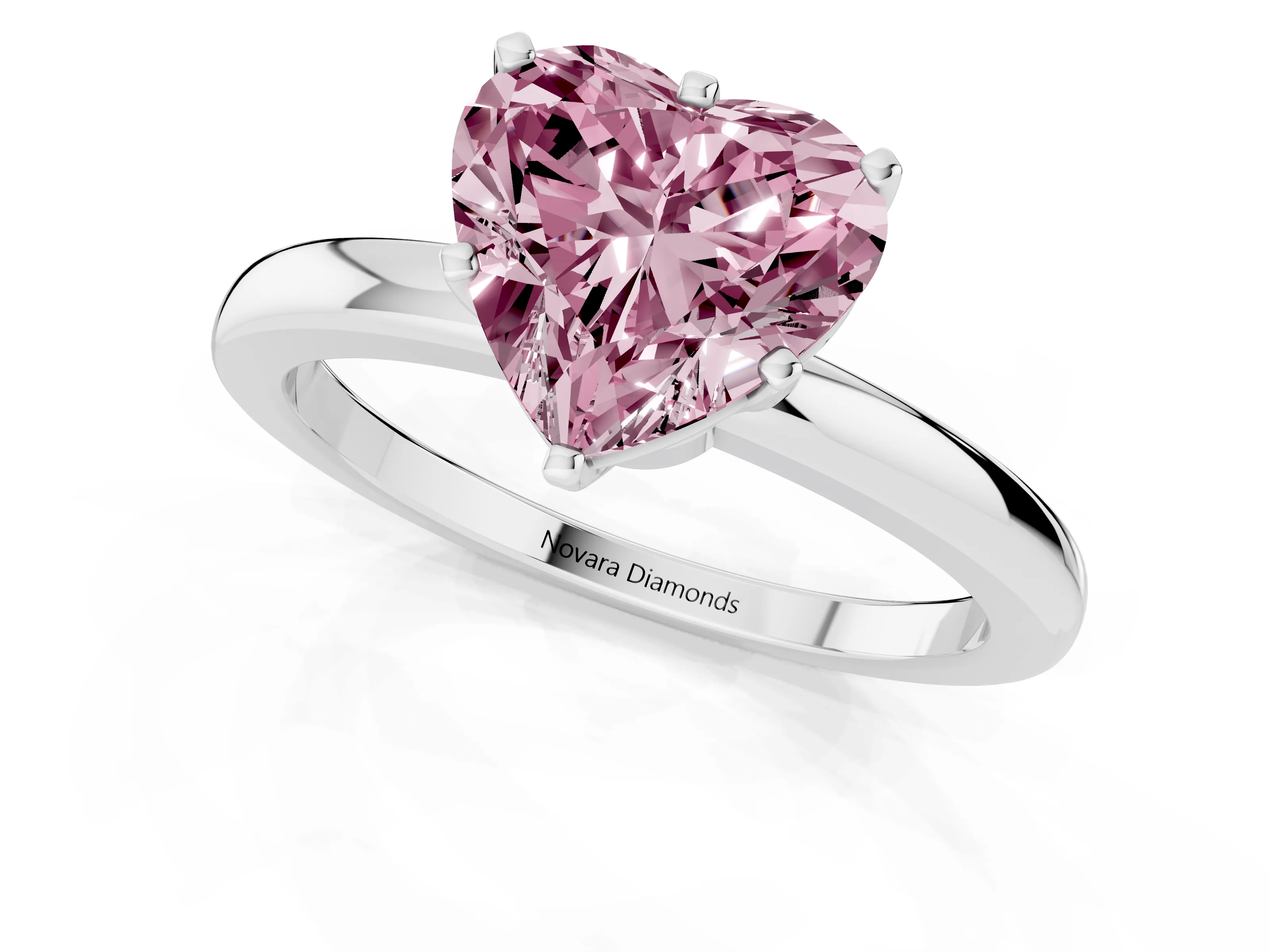 Fancy Pink Heart Cut Diamond Solitaire Ring Set in White gold with Raised Prong Setting on a Classic Band