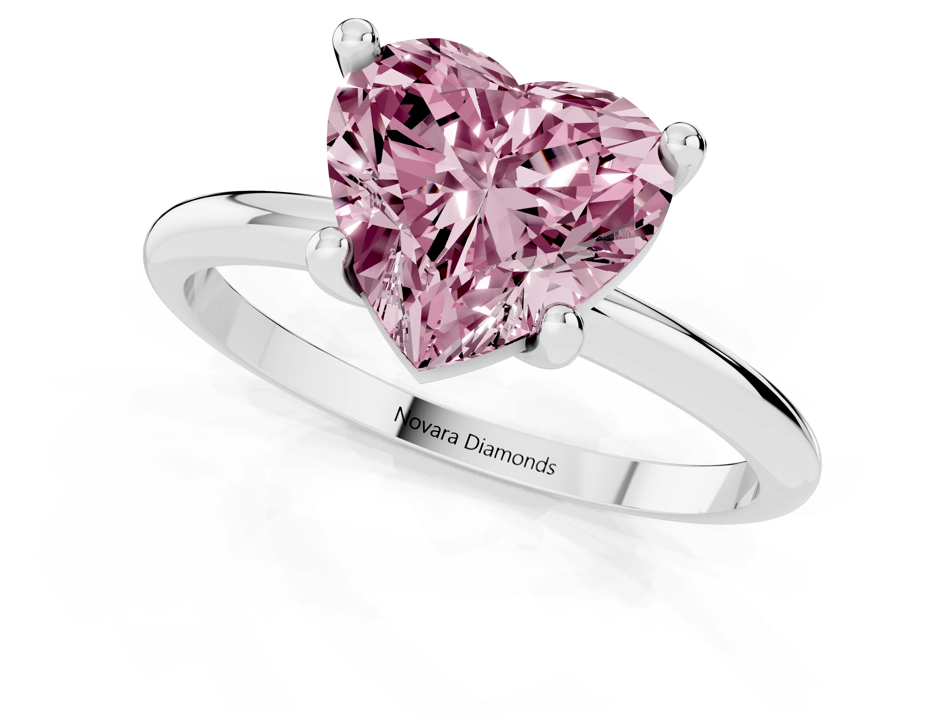Fancy Pink Heart Cut Diamond Solitaire Ring Set in Platinum with Secure Prong Setting on a Classic Band