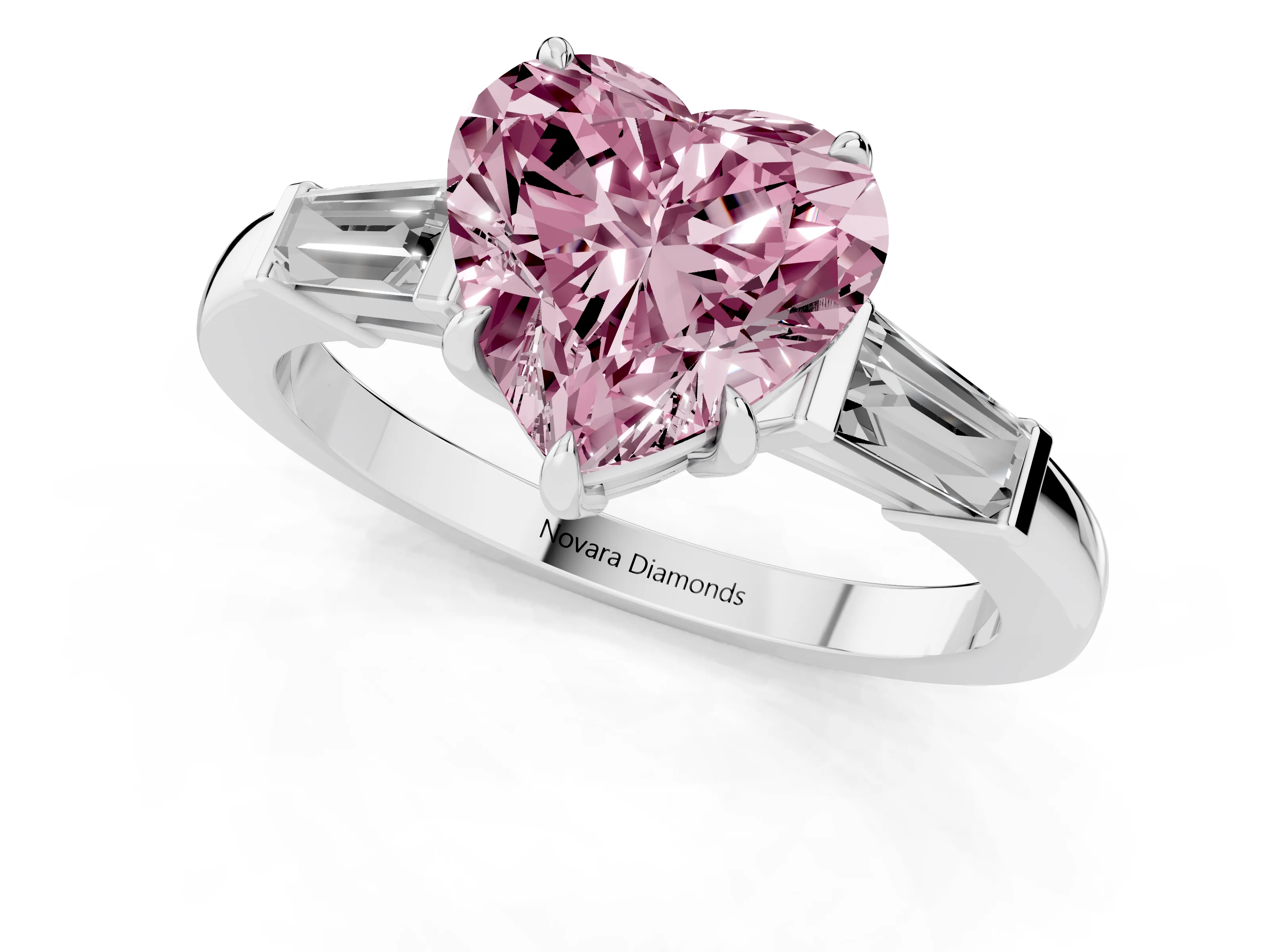 Fancy Pink Heart Cut Diamond Three-Stone Ring Set in Platinum with Tapered Baguette Side Stones and Prong Setting